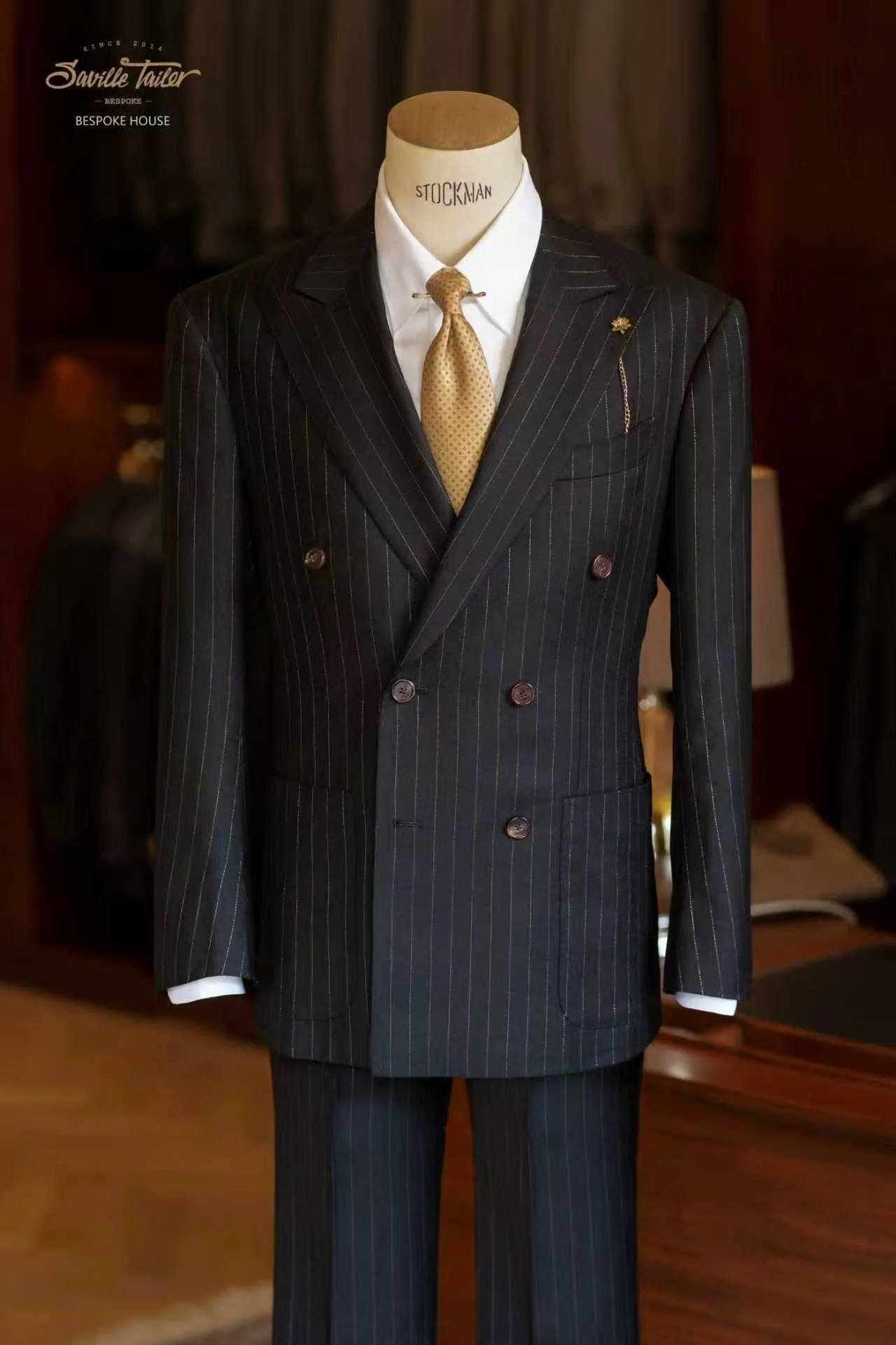 A dark stripe bespoke suit.