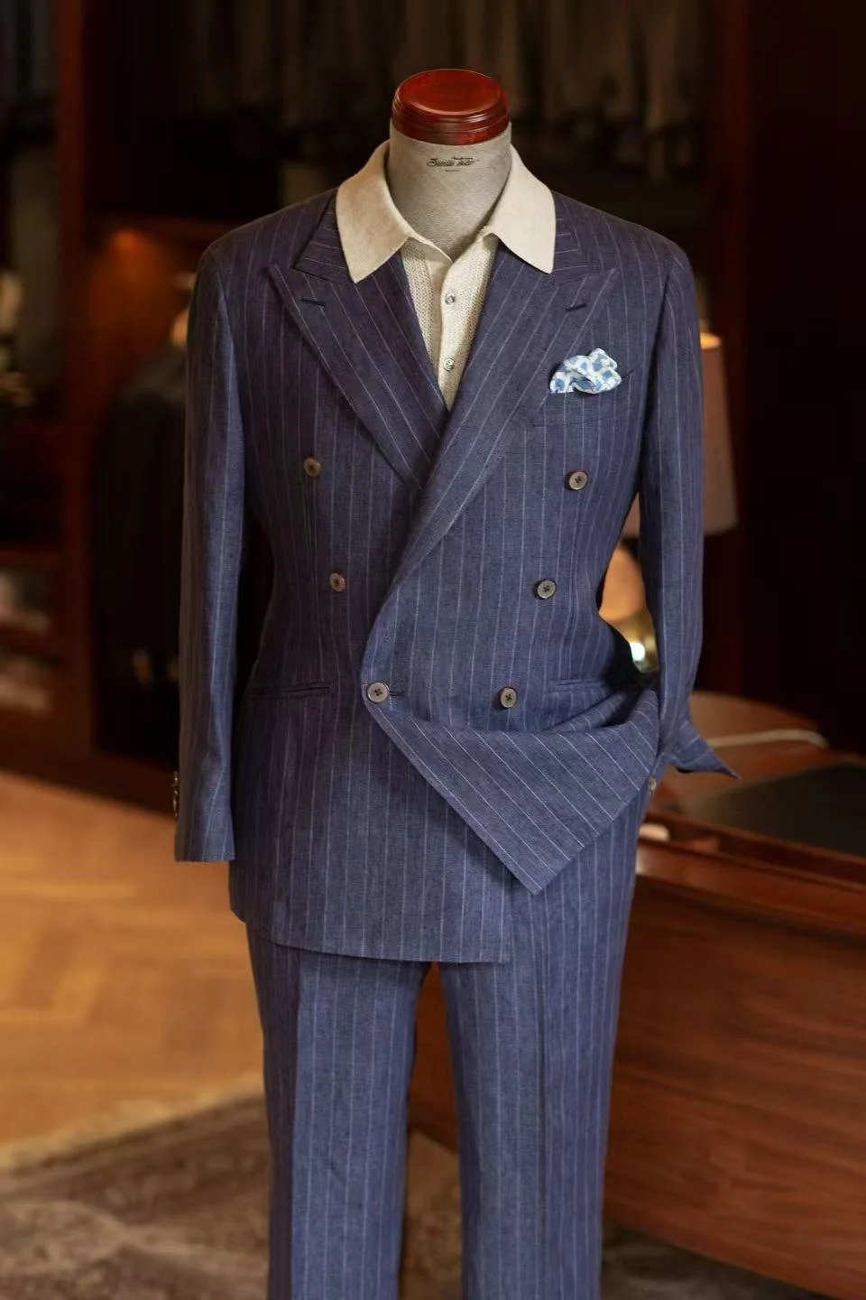 A bespoke blue pinstripe double-breasted suit.