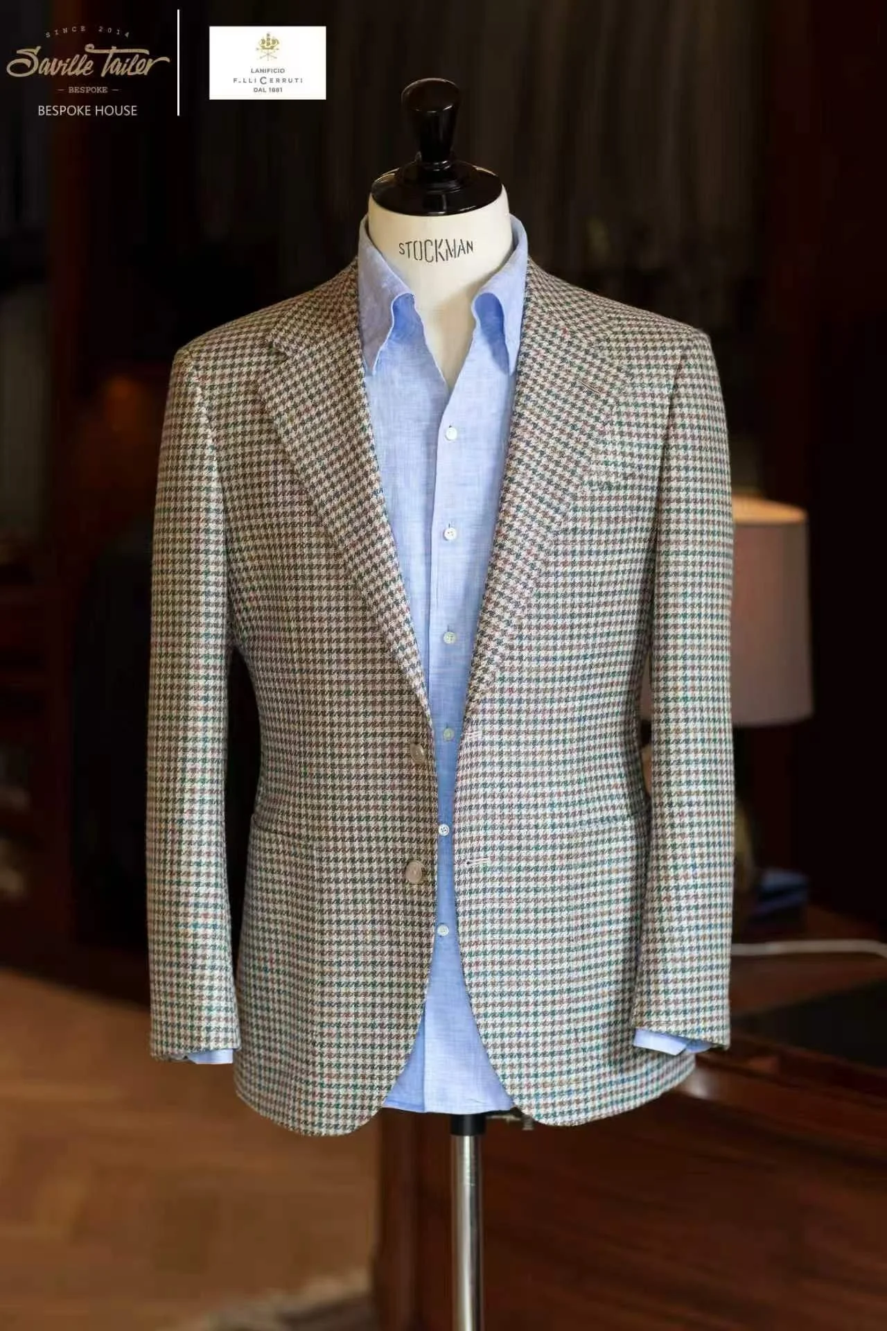 A custom suit with tailored light blue shirt.