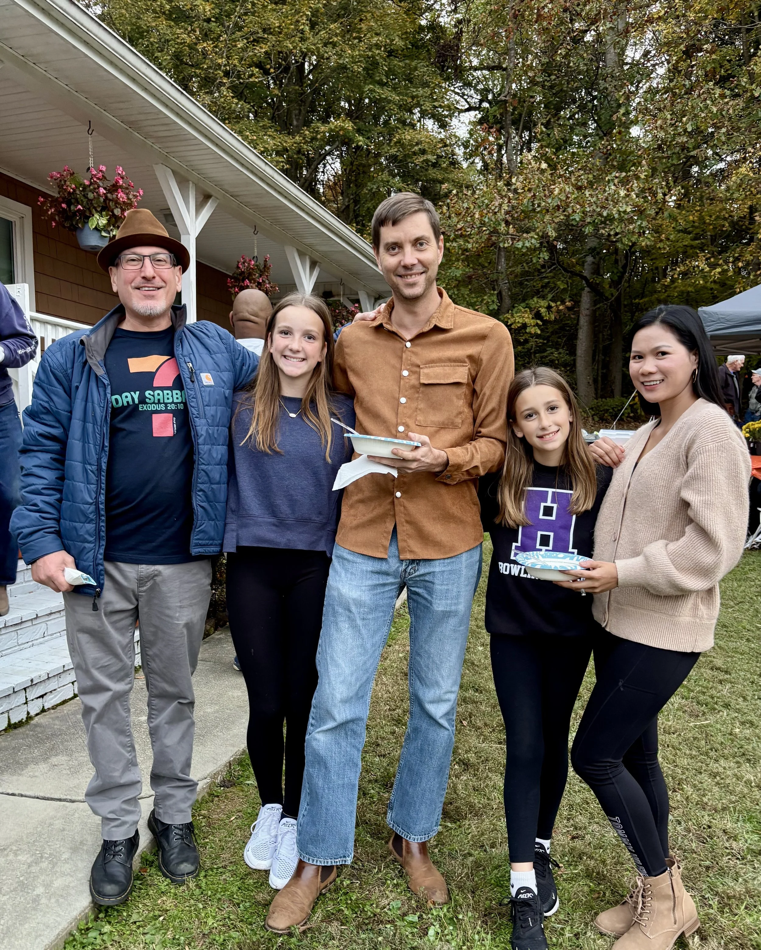  Group of friends holding food and smiling together 