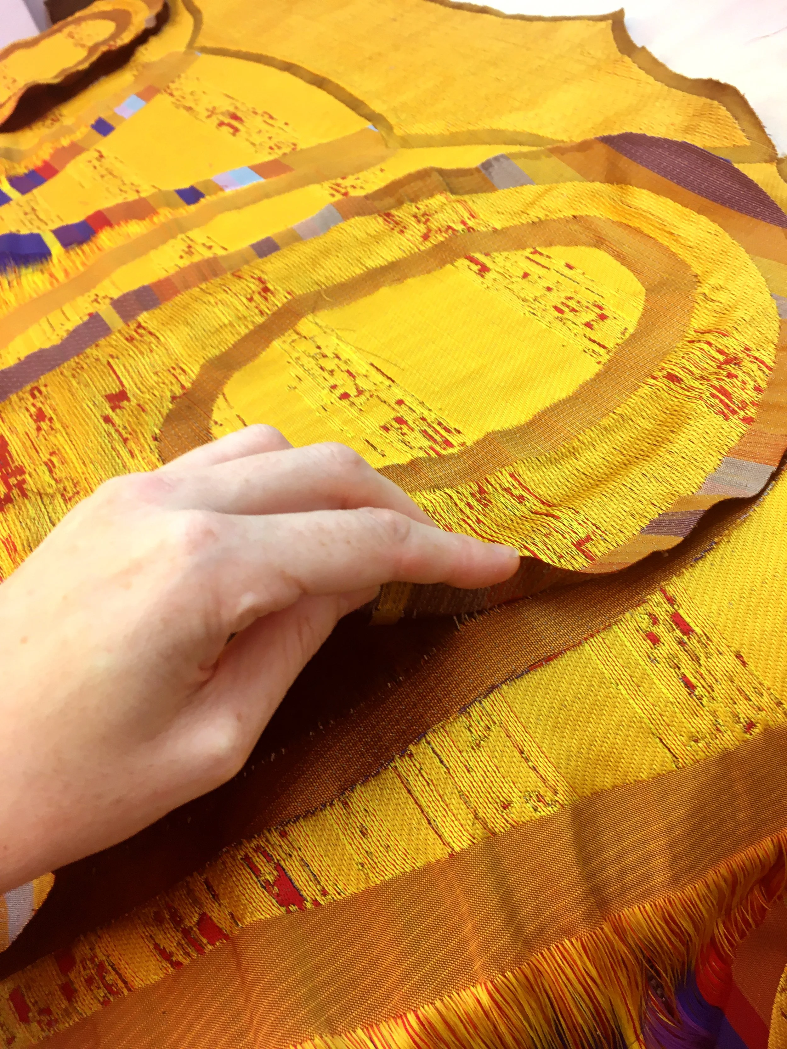 Zero Waste Weavers - Sulfuric Tunic cutting and layers detail. Textile-form Woven 100% recyclable polyester with heat reactive yarn for adaptive fit