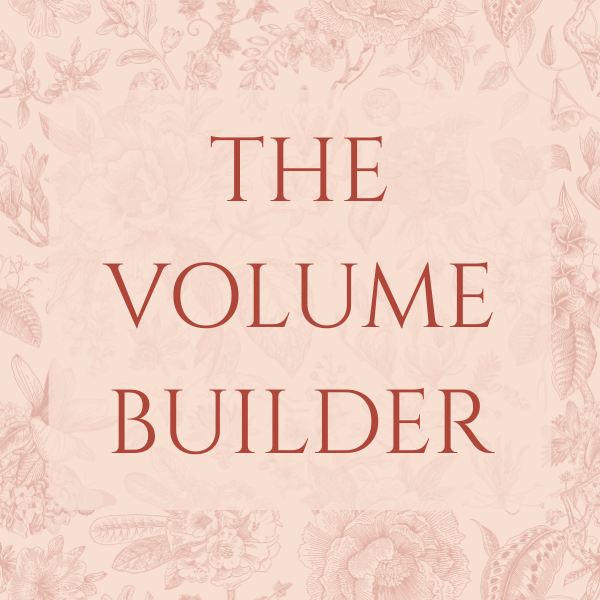 Book cover titled "The Volume Builder" with a pink floral background and red text.