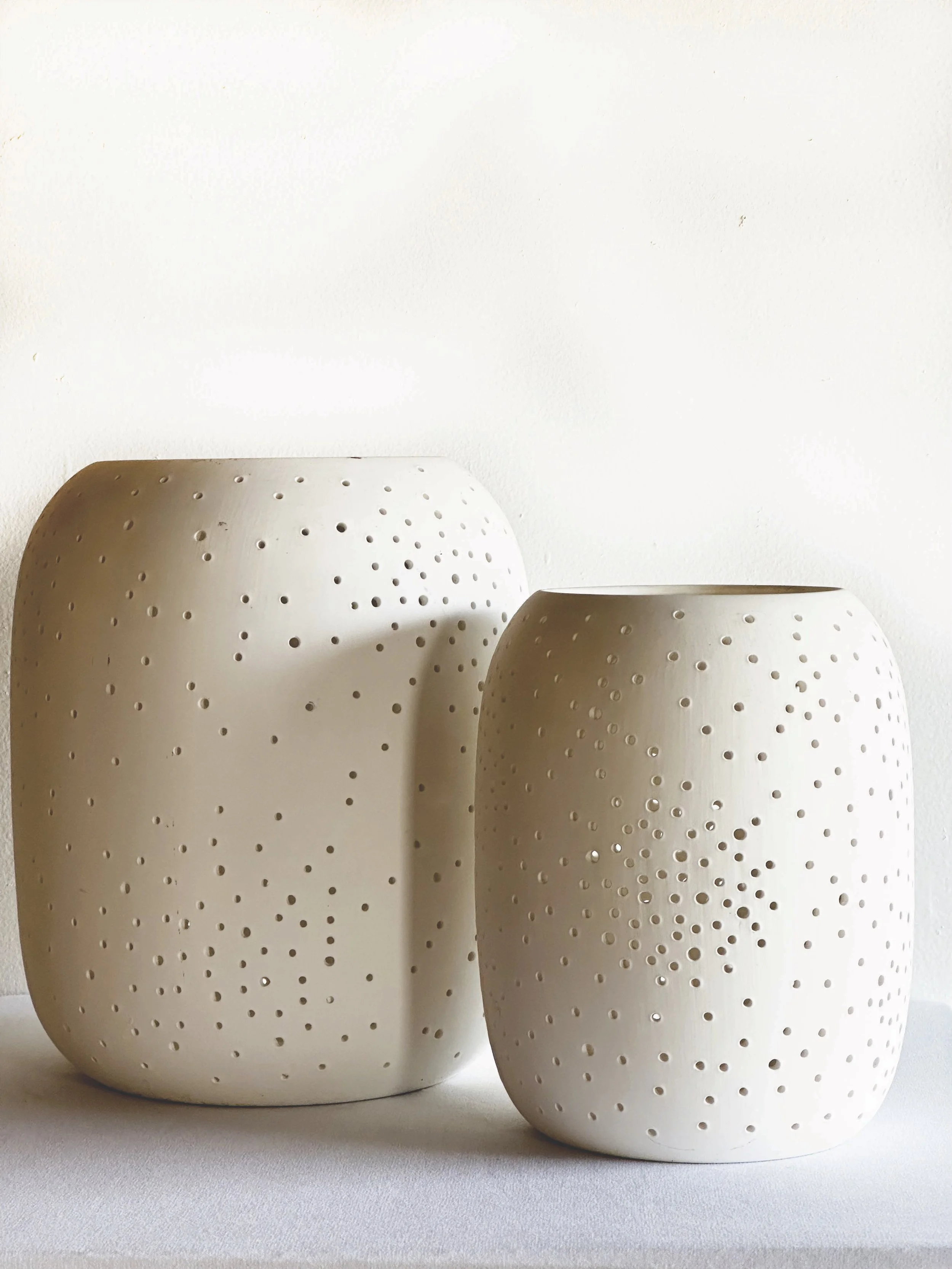 Constellation Pierced Ceramic Candleholders
Medium: 5.75"DIA x 7"H 
Large: 7.7"DIA x 9"H