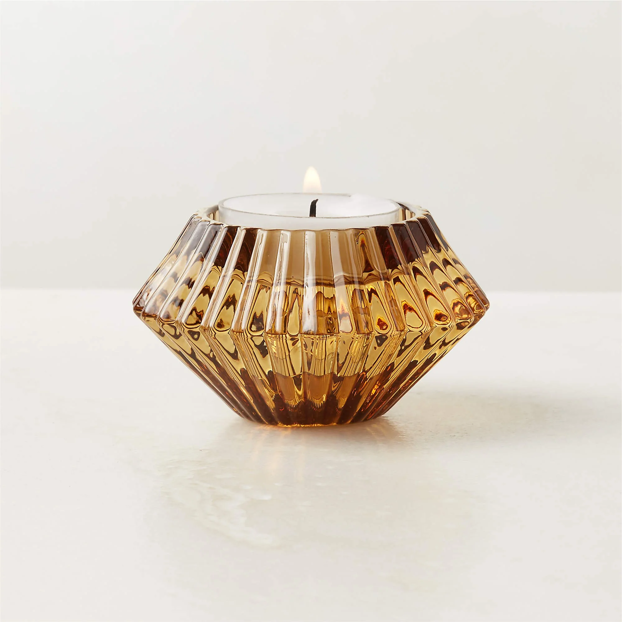 Nova Ribbed Amber Glass Reversible Candle Holder (3"Wx3"Dx1.75"H)

*Can be used with votive OR taper candles!