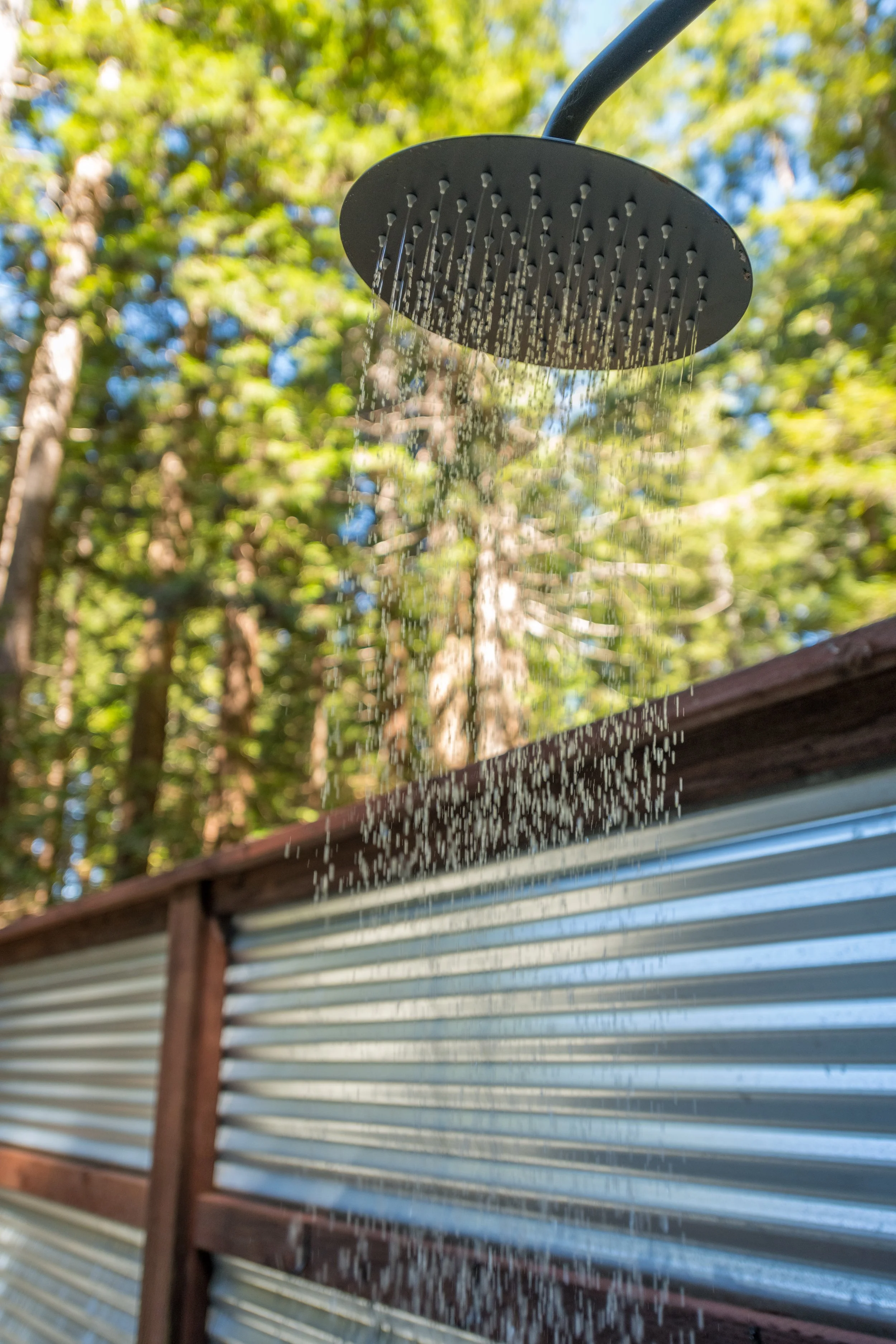 outdoor shower looking up mendo house.JPG