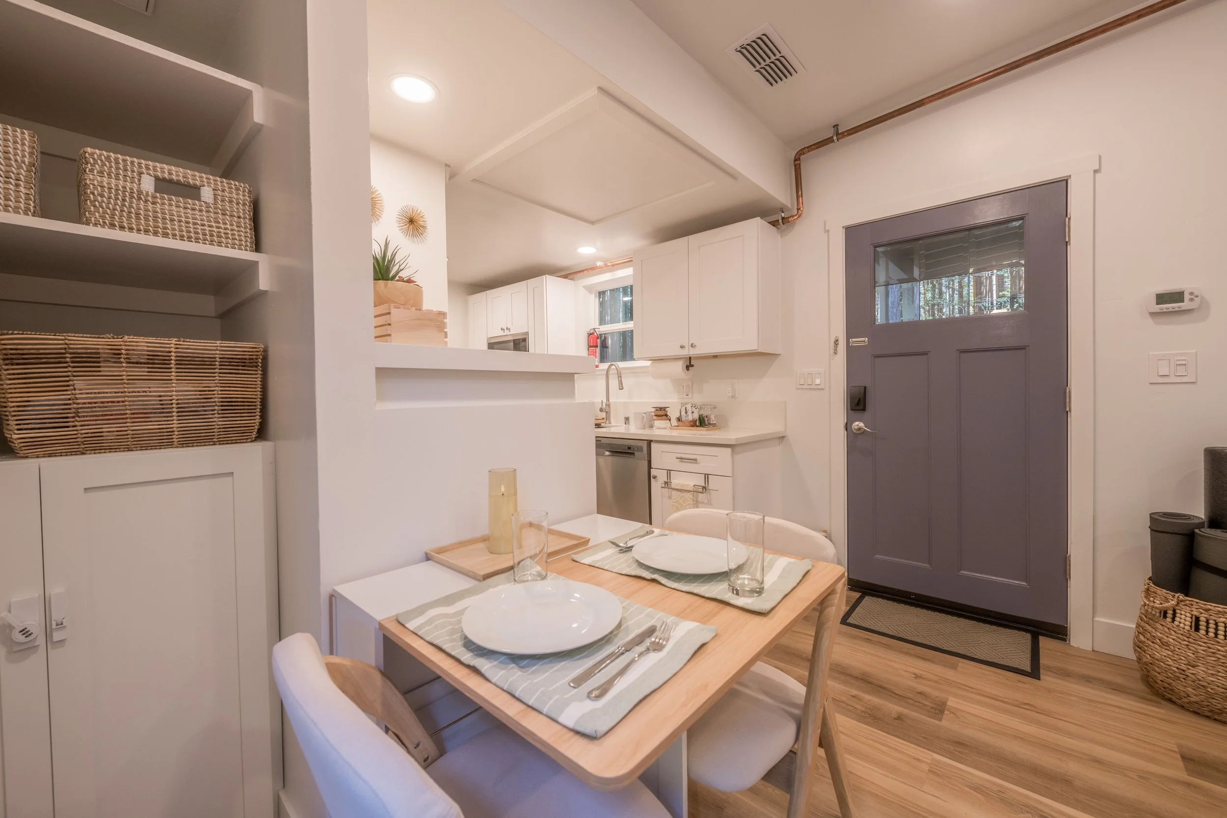 indoor table set towards front door mendo house.JPG