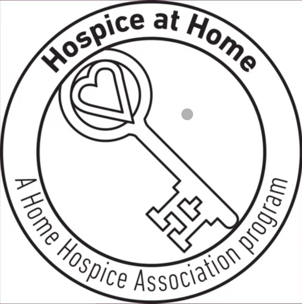 Logo for Hospice at Home, a home hospice association program, featuring a heart inside a circle and a key with a heart-shaped top.