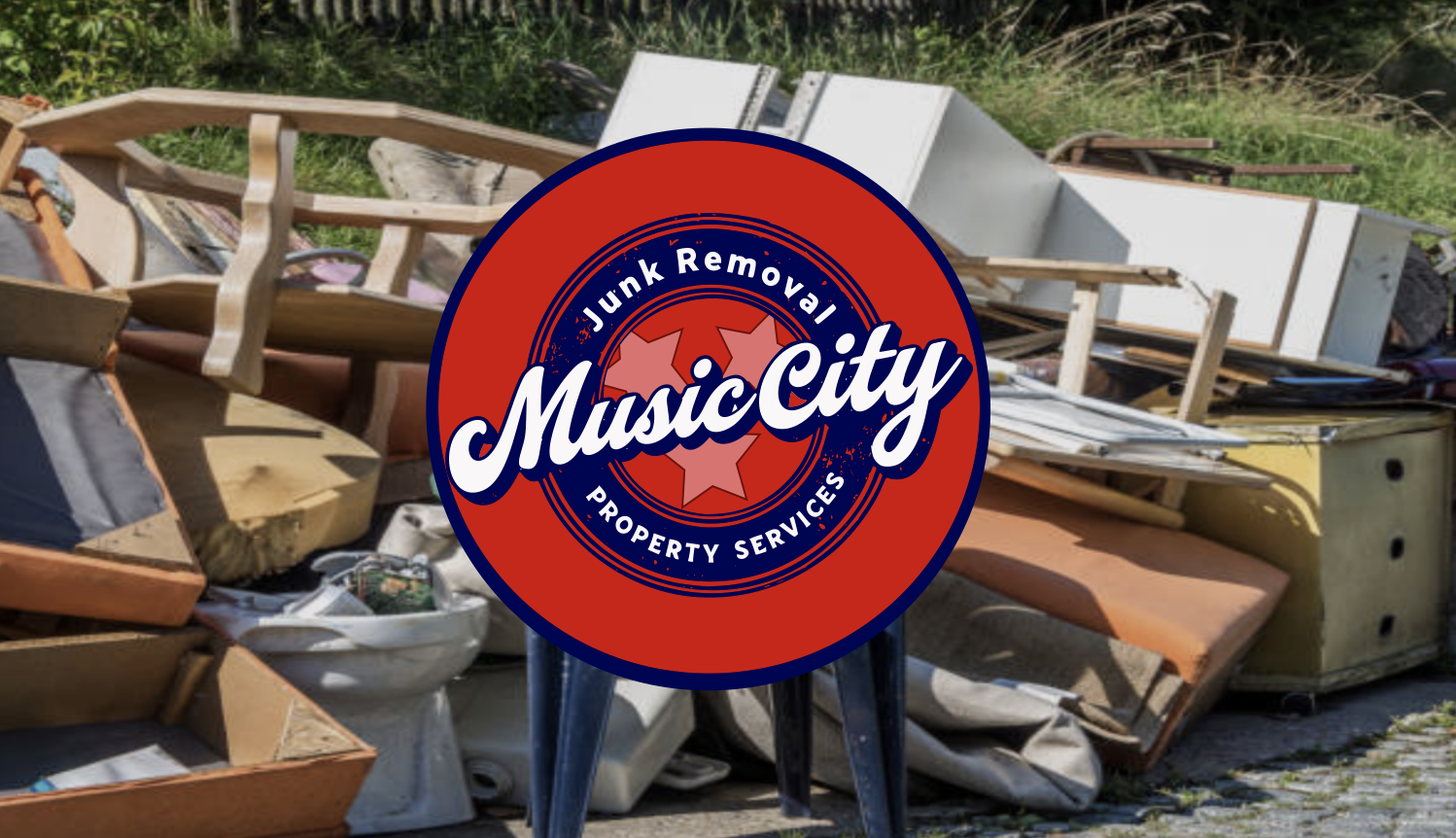Pile of discarded furniture and household items outside with a 'Music City Junk Removal Property Services' sign in front.