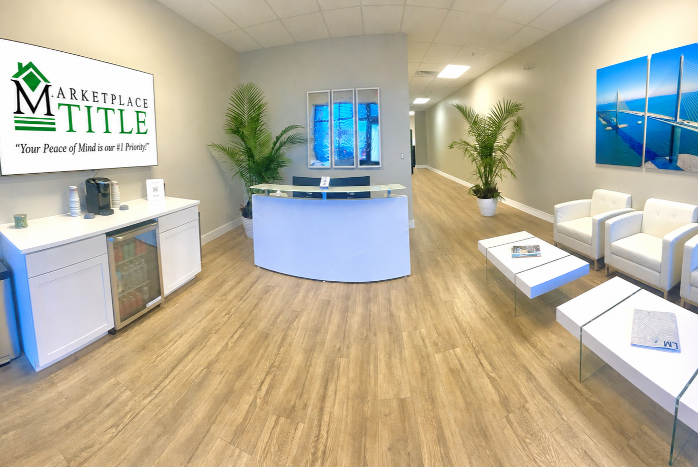 Marketplace Title Cape Coral reception area with beverage center and seating area in a modern professional real estate closing office
