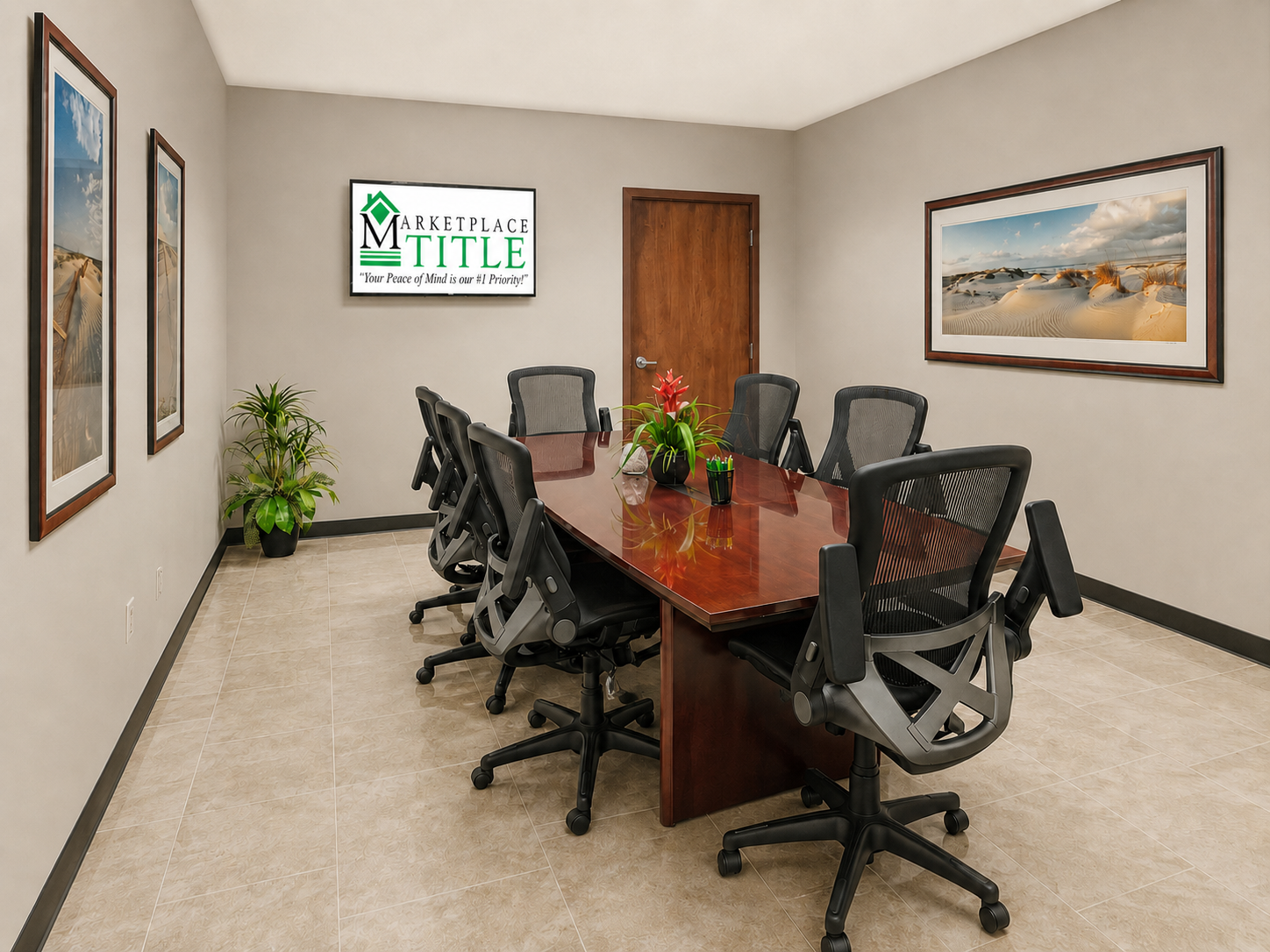 Marketplace Title Estero closing room with polished conference table and client welcome screen in a professional real estate closing setting