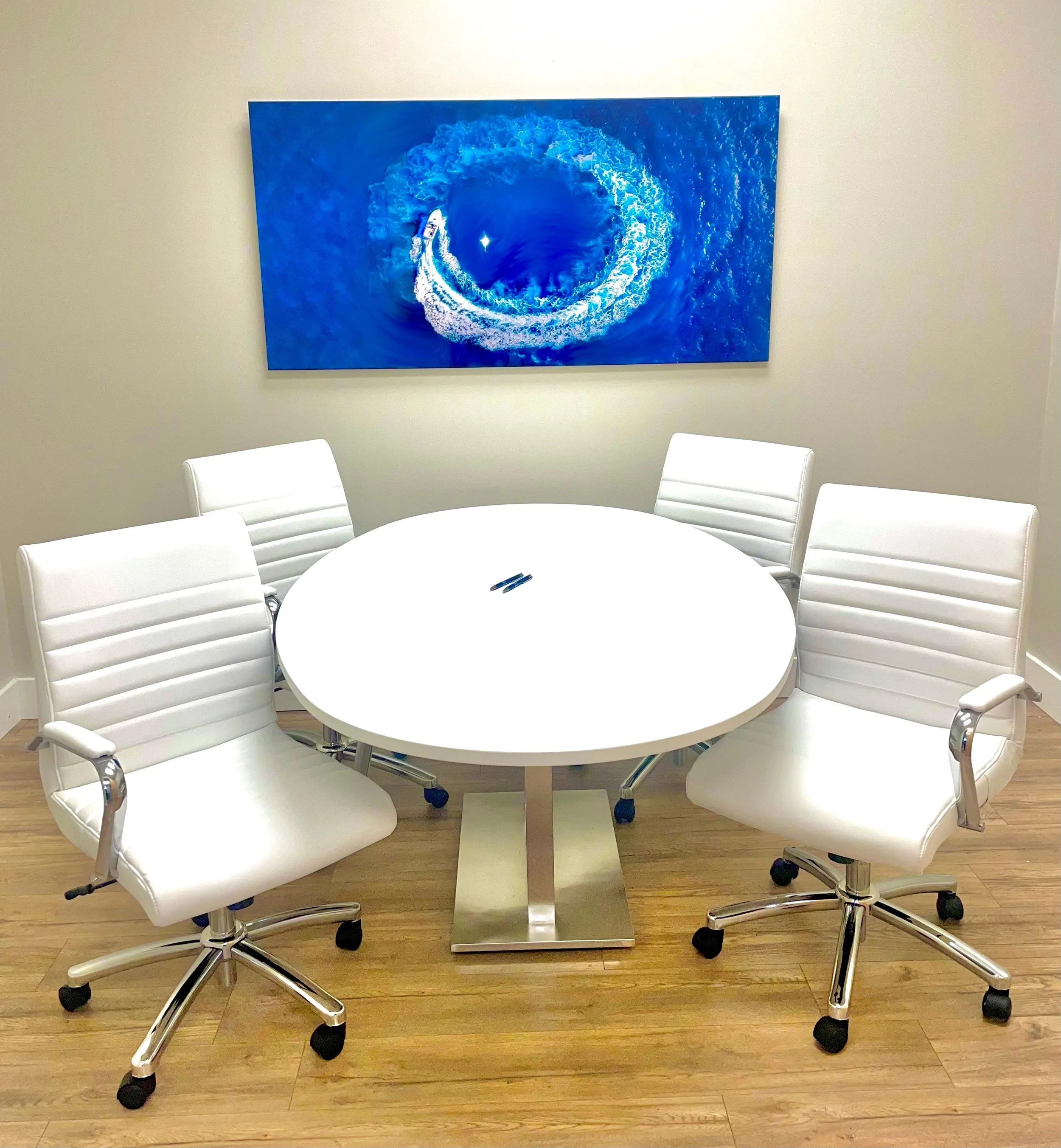 Marketplace Title Cape Coral closing room with conference table and client welcome screen in a professional real estate closing setting