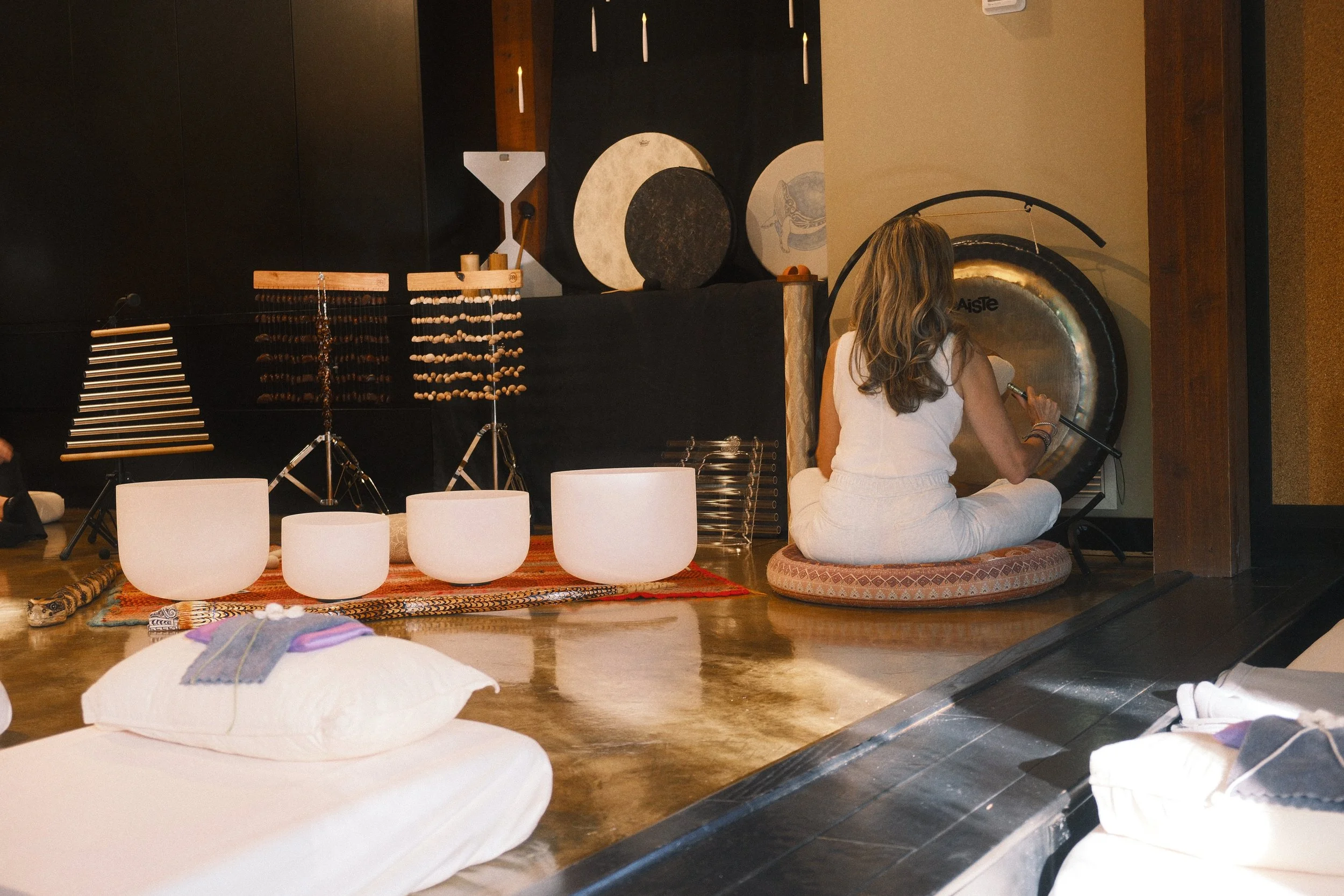 Experience Sound Journeys, our signature offering and the heart of what we do. Crystal bowls, gong, drum, chimes — live instruments that invite the body to soften and the mind to still. 