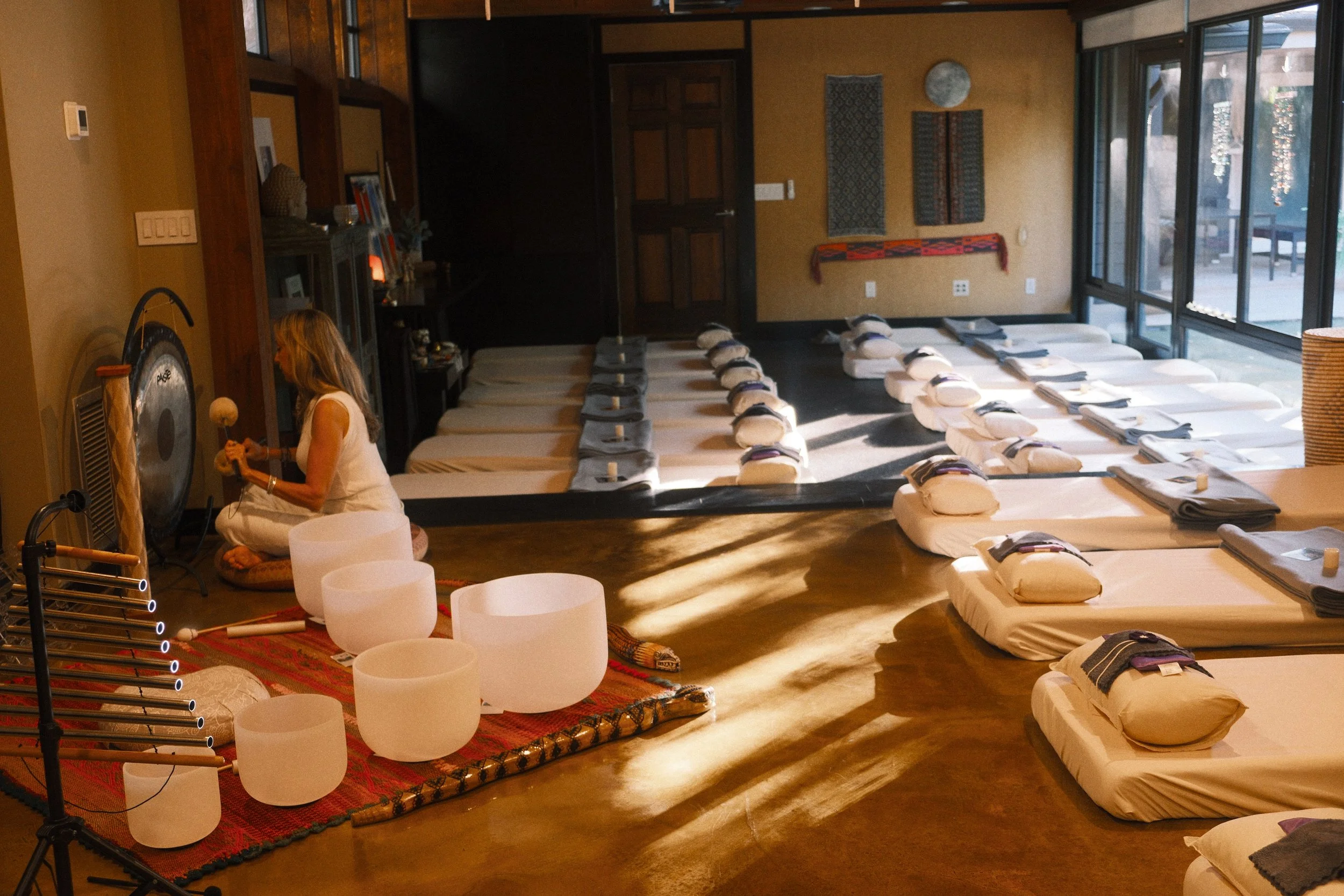 Experience Sound Journeys, our signature offering and the heart of what we do. Crystal bowls, gong, drum, chimes — live instruments that invite the body to soften and the mind to still. 