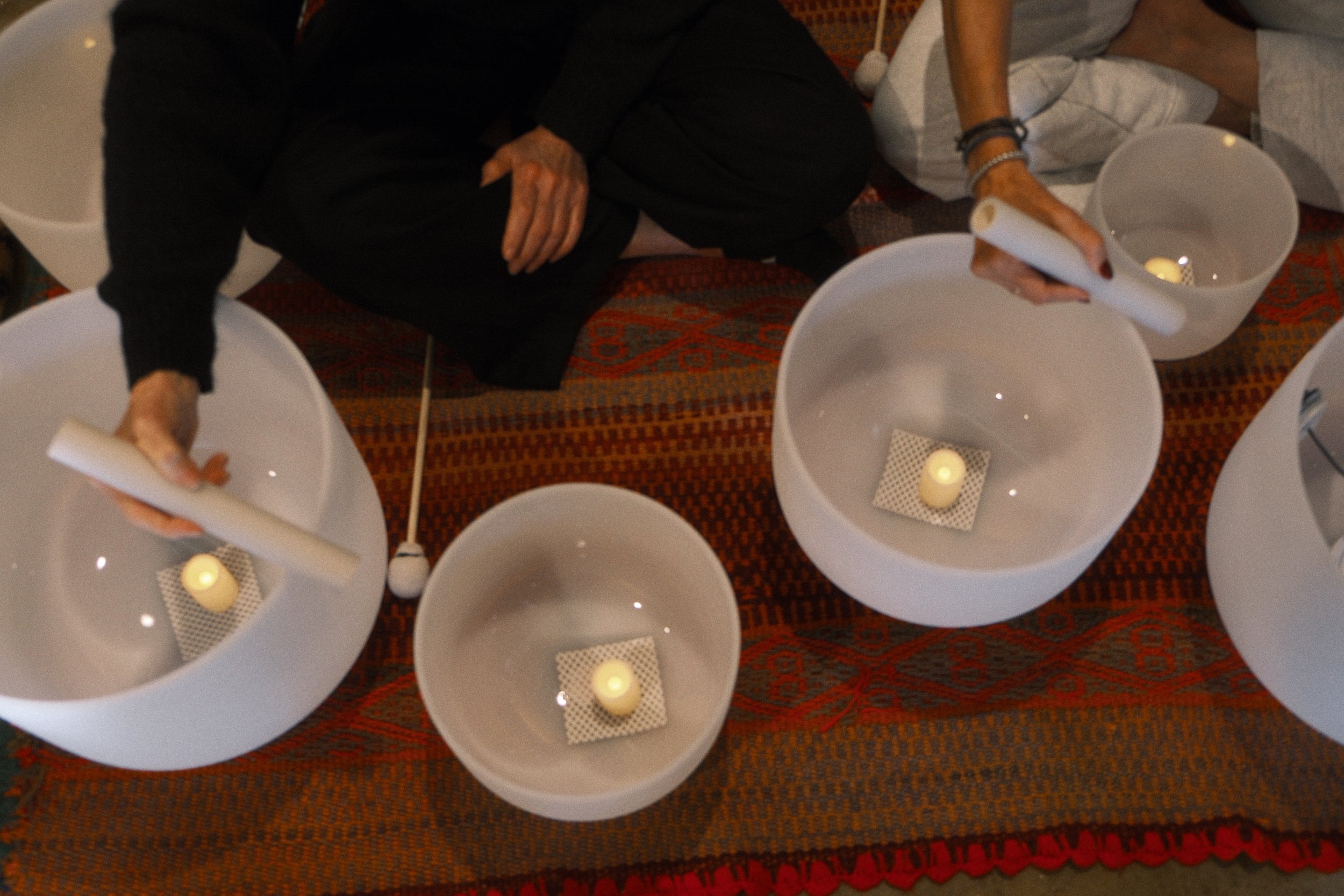 Experience Sound Journeys, our signature offering and the heart of what we do. Crystal bowls, gong, drum, chimes — live instruments that invite the body to soften and the mind to still.  