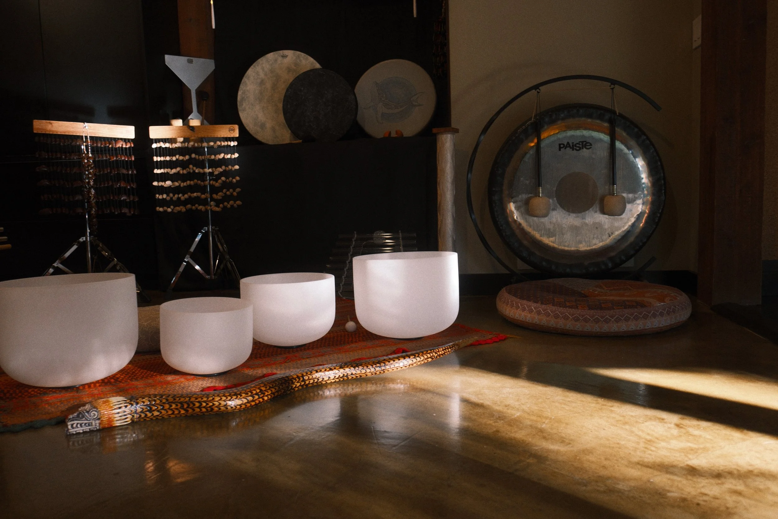 Experience Sound Journeys, our signature offering and the heart of what we do. Crystal bowls, gong, drum, chimes — live instruments that invite the body to soften and the mind to still. 