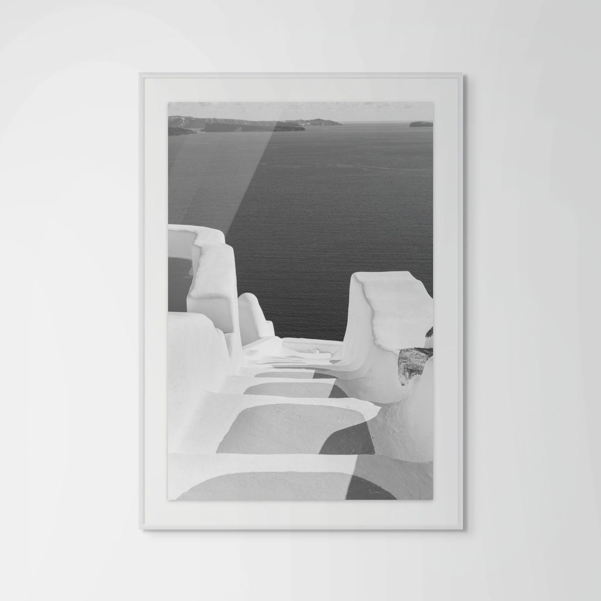 Black and white Santorini fine art print framed - Aegean coastline photography by Eva Rendl Studio