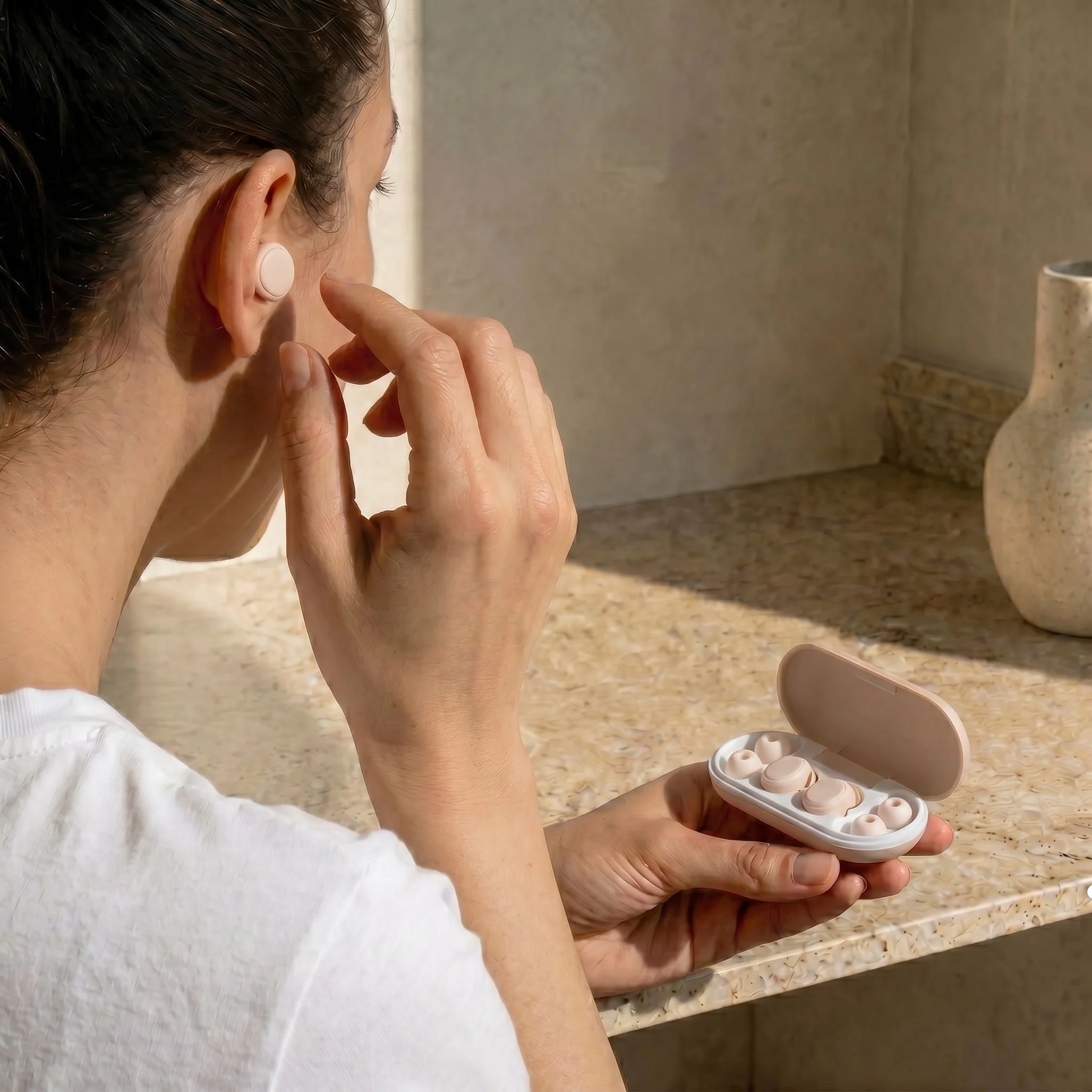 nano-banana-2_she_is_putting_the_earplug_the_other_way_round_is_weird_what_she_is_putting_just-0.jpg