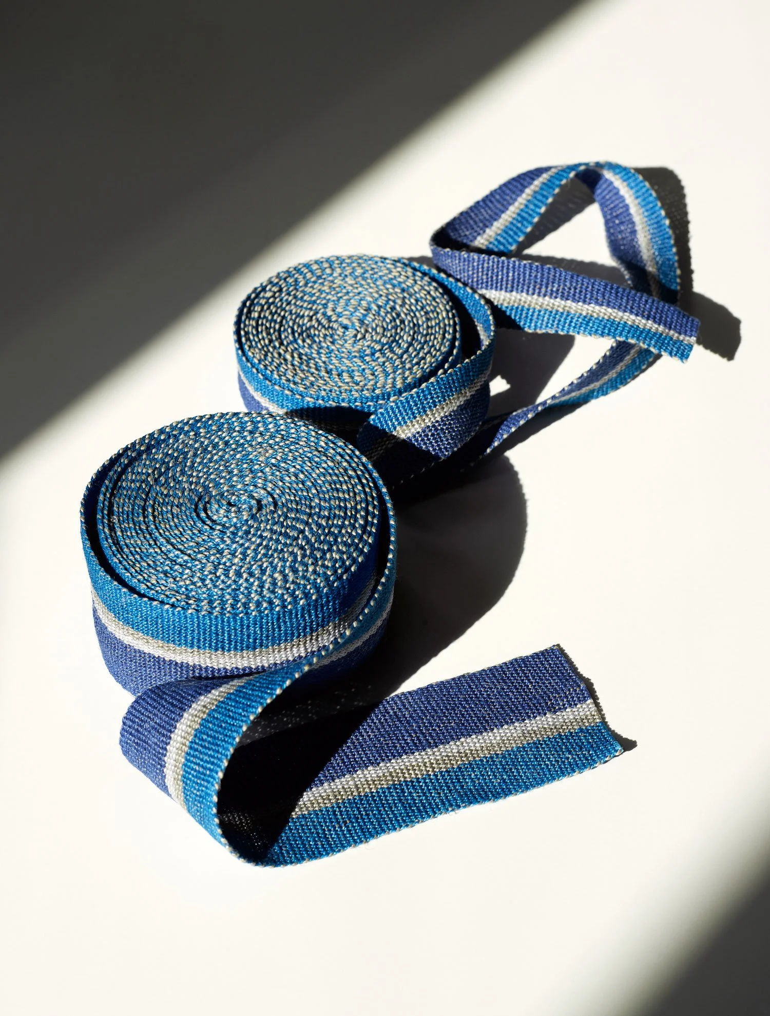 Ocean handwoven linen tape trim in two bold blues in narrow and medium widths.