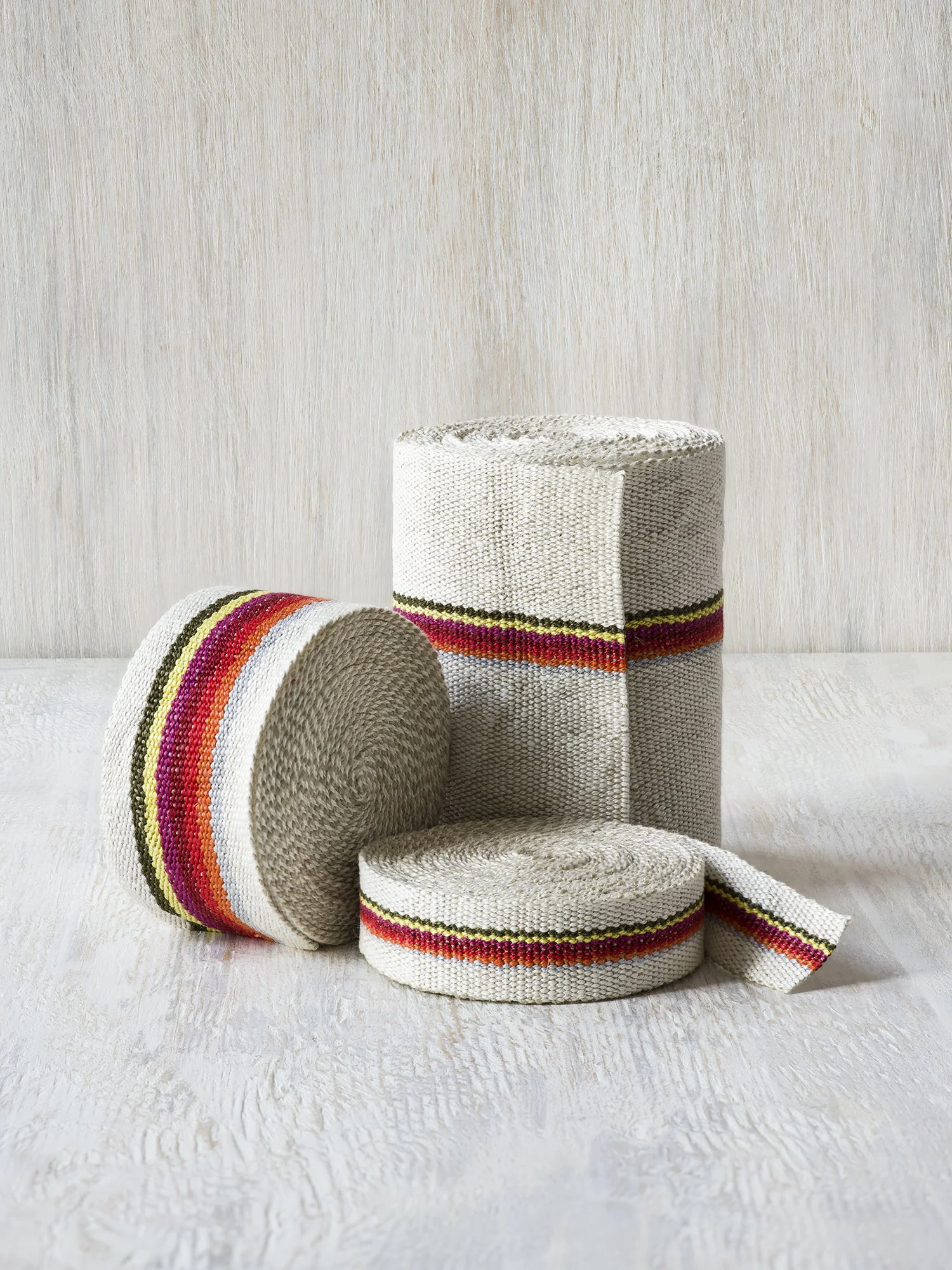 HG 1935 handwoven linen tape trim in vintage rainbow of bright colors on white in narrow, medium and wide widths.