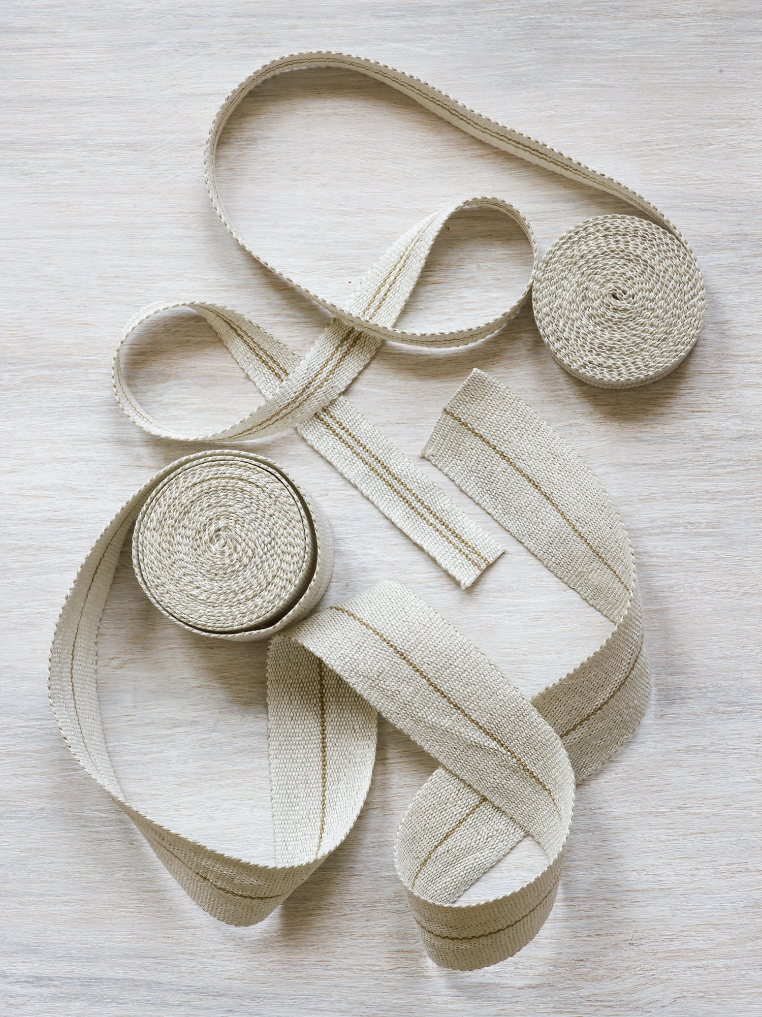 Modern Neutral II: Field Lines Handwoven Linen Tape Collection

In this muted trio, fine gold lines create a quiet geometry in a field of white linen.

Using a palette of white, black, gold and bronze linen, I designed the Modern Neutrals to compleme