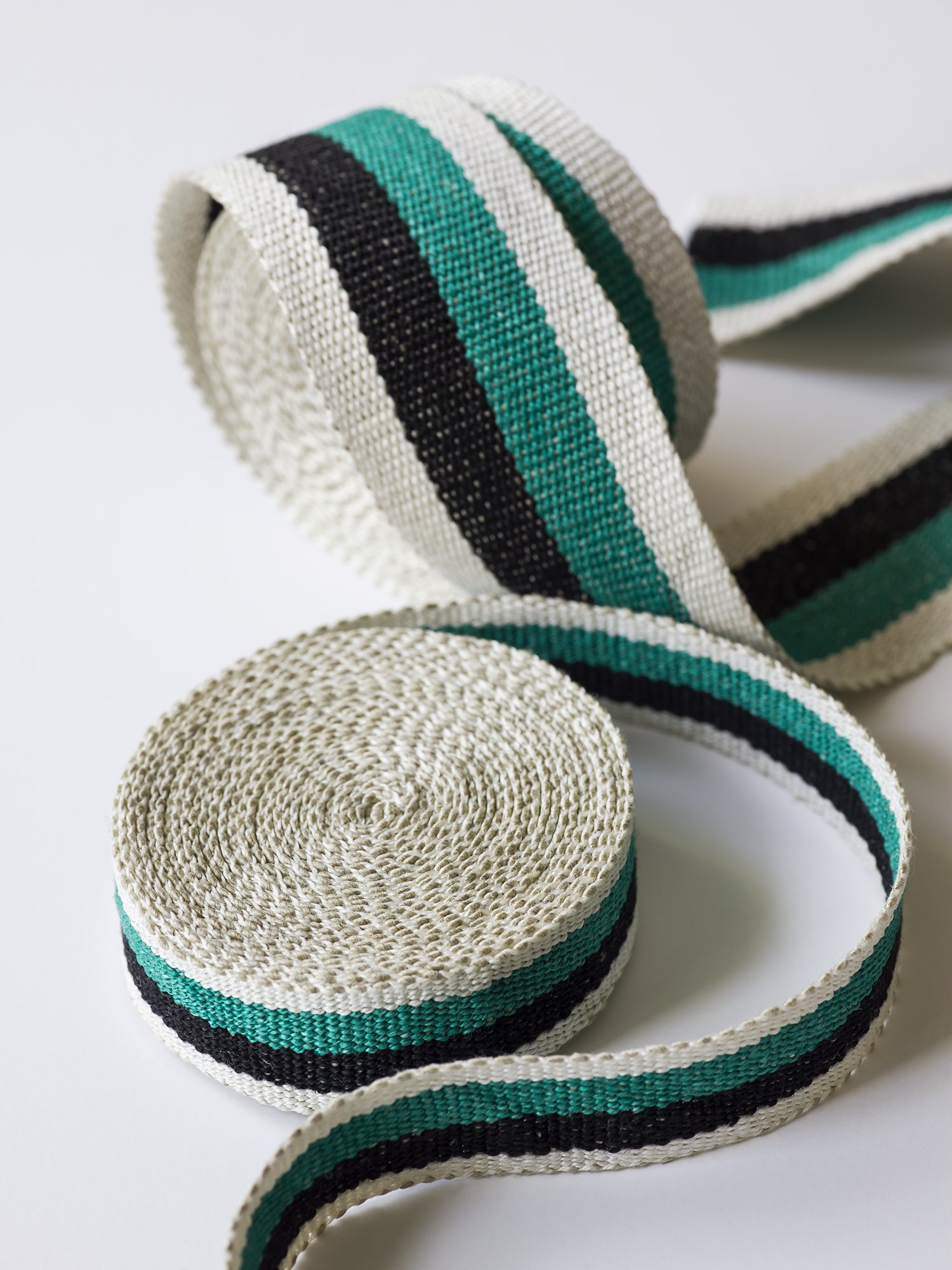 Dorothy handwoven linen tape trim in a bright emerald green, black and white in narrow and medium widths.