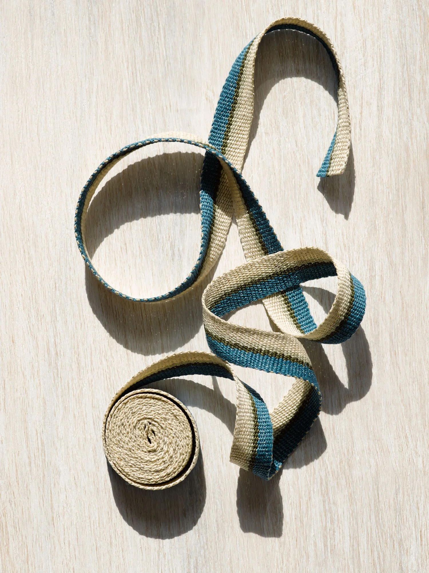 Silver Blue handwoven linen tape trim in dark cerulean blue, dark olive, sage and ivory in narrow width.