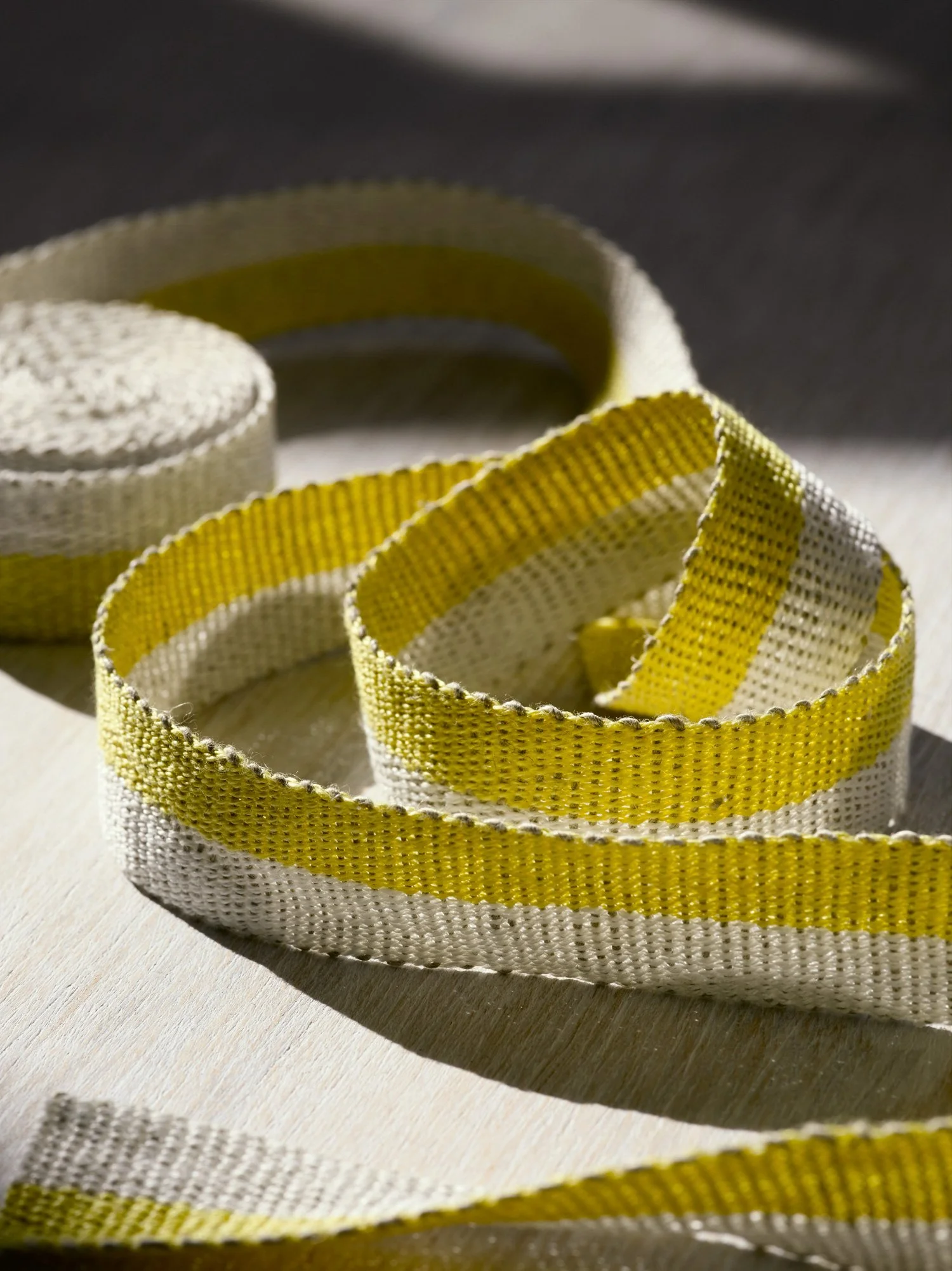 Fresh Yellow handwoven linen tape trim in a soft, bright yellow and white in narrow width.