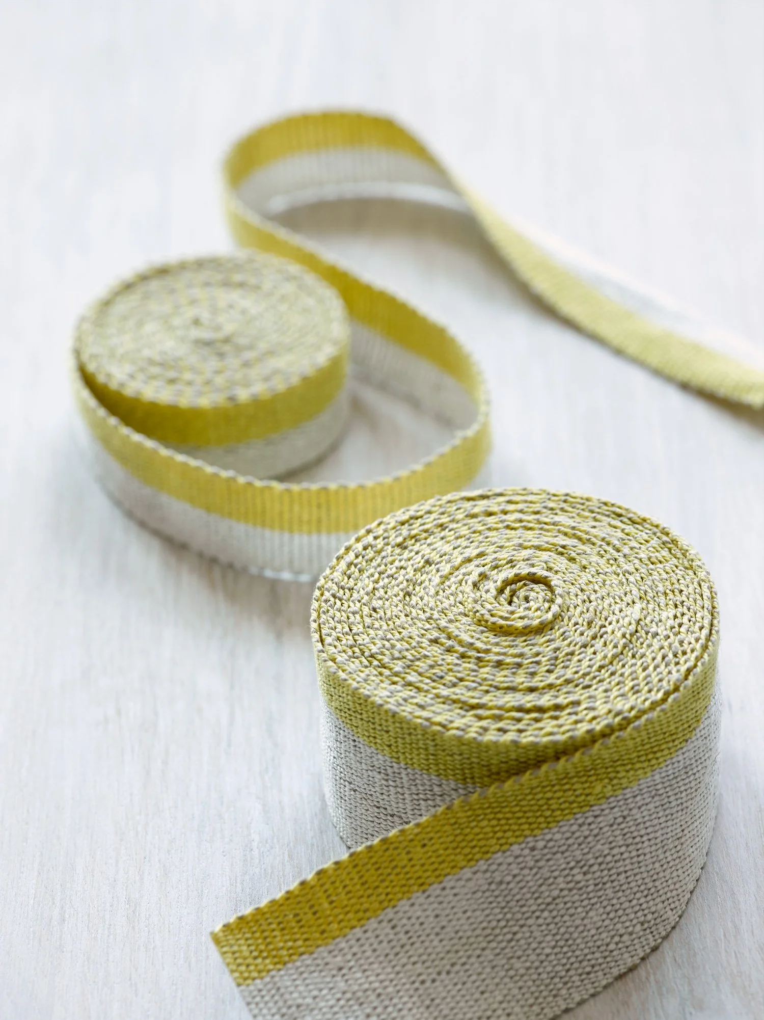 Fresh Yellow handwoven linen tape trim in a soft, bright yellow and white in narrow and medium widths.