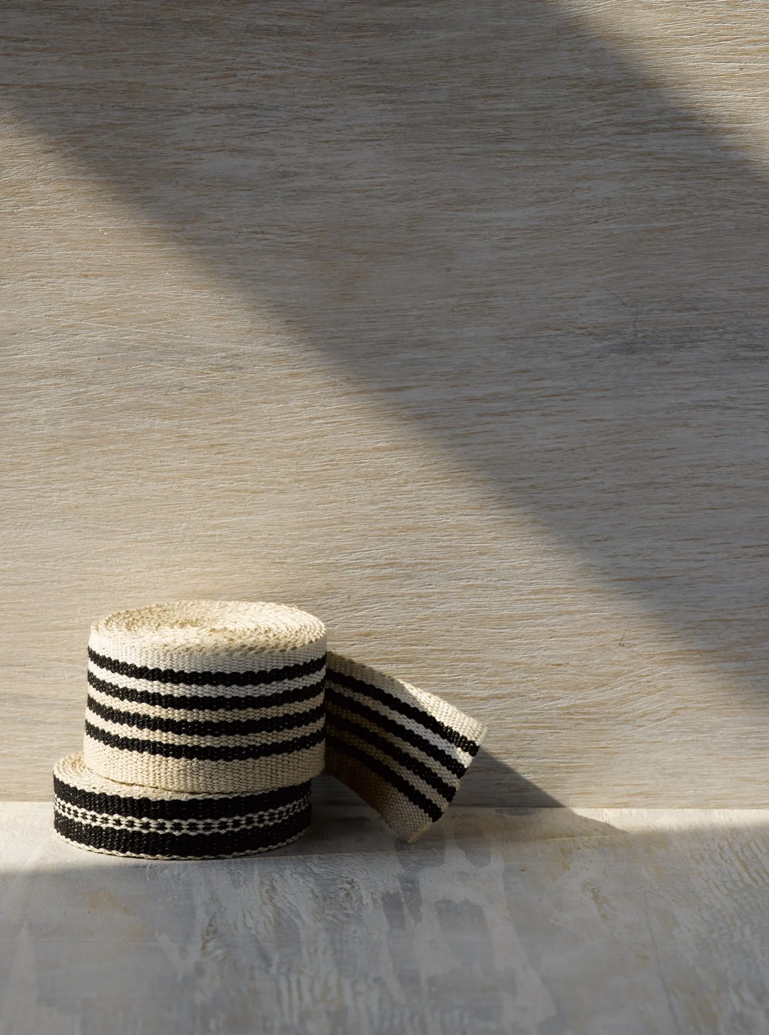 Old Tuxedo handwoven linen tape trim in black, ivory and cream in narrow and medium widths.