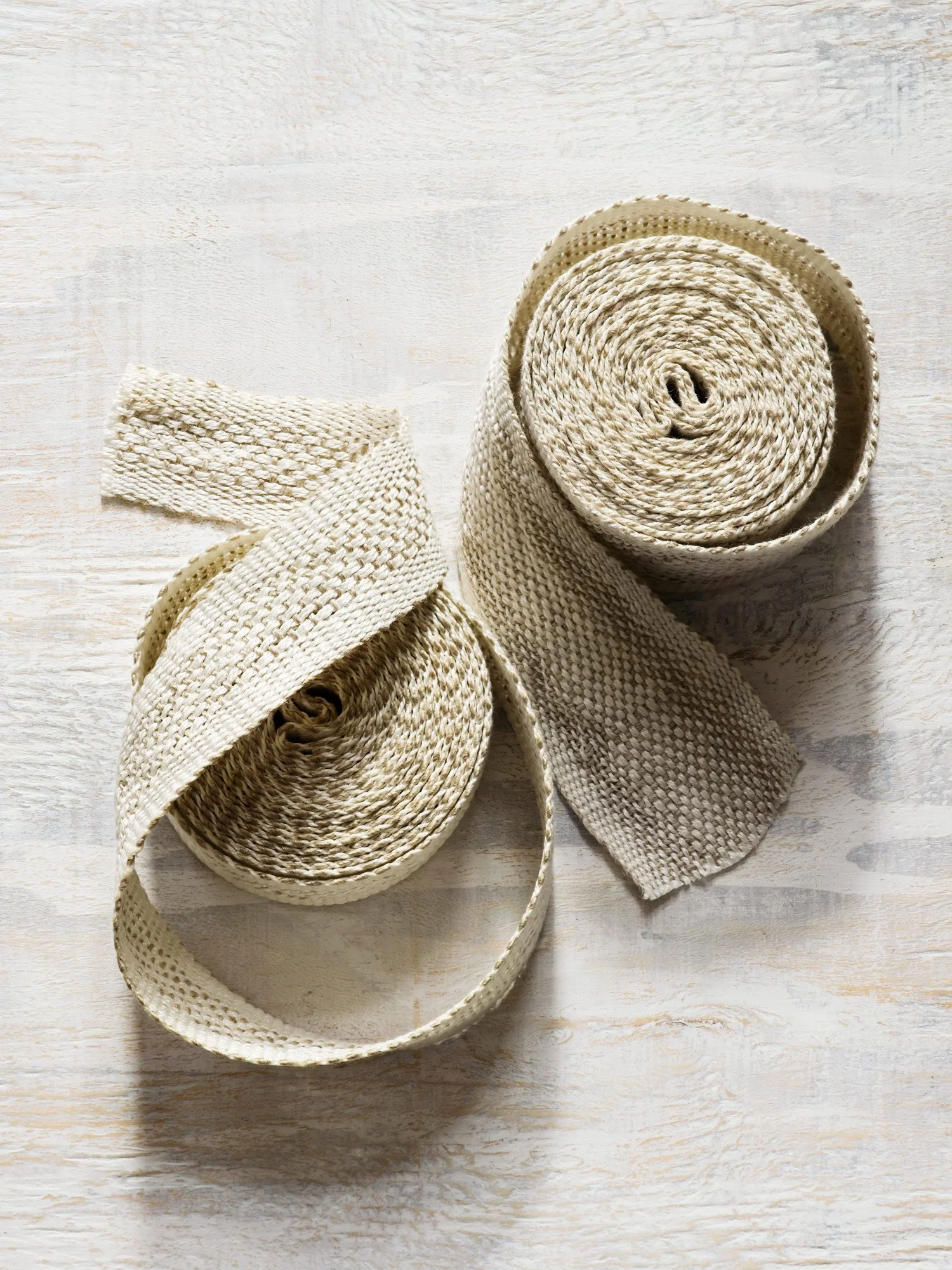 White Fretwork handwoven linen tape trim in a soft white patterned weave in narrow and medium widths.