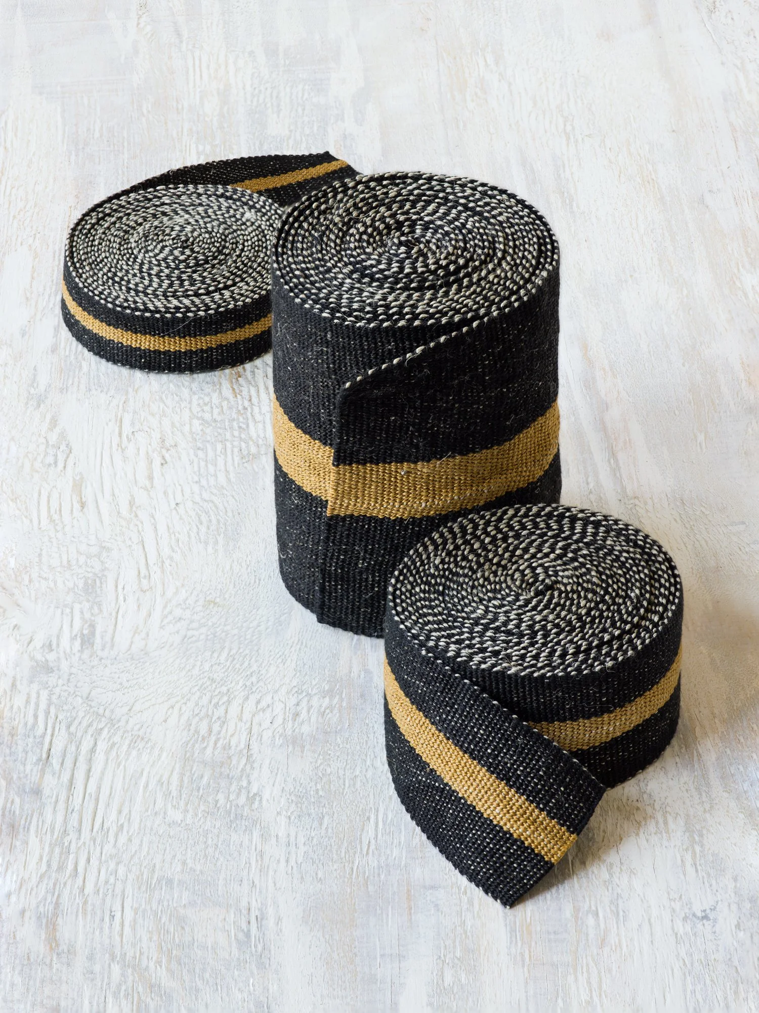 Modern Neutral I: Black and Bronze handwoven linen tape trim in black with a bold bronze band in narrow, medium and wide widths on flat field.