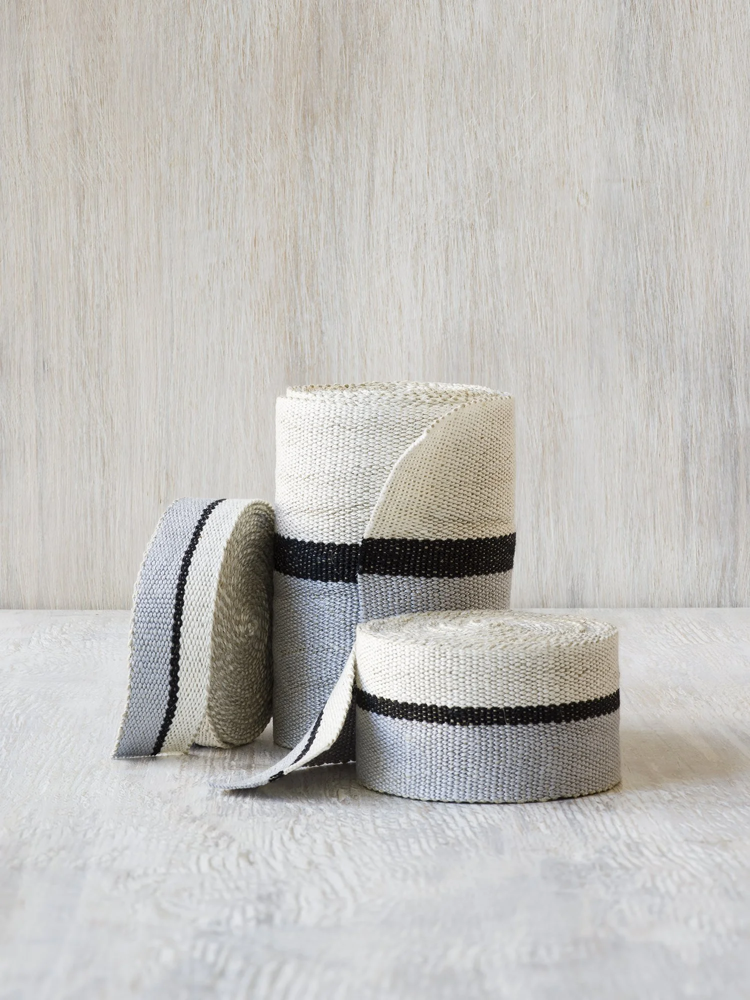 Ile Saint-Louis handwoven linen tape trim in silvery blue, black and white in narrow, medium and wide widths.