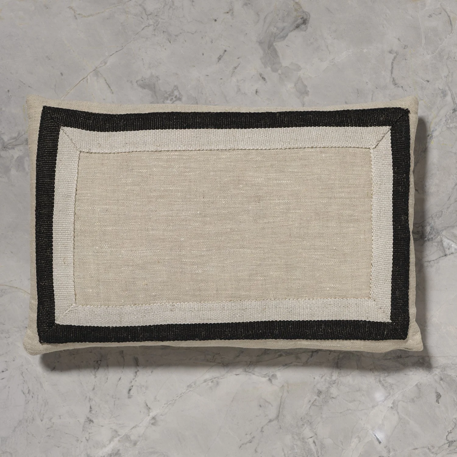 12x18" flax pillow with framed medium detail of Half Black handwoven linen tape trim