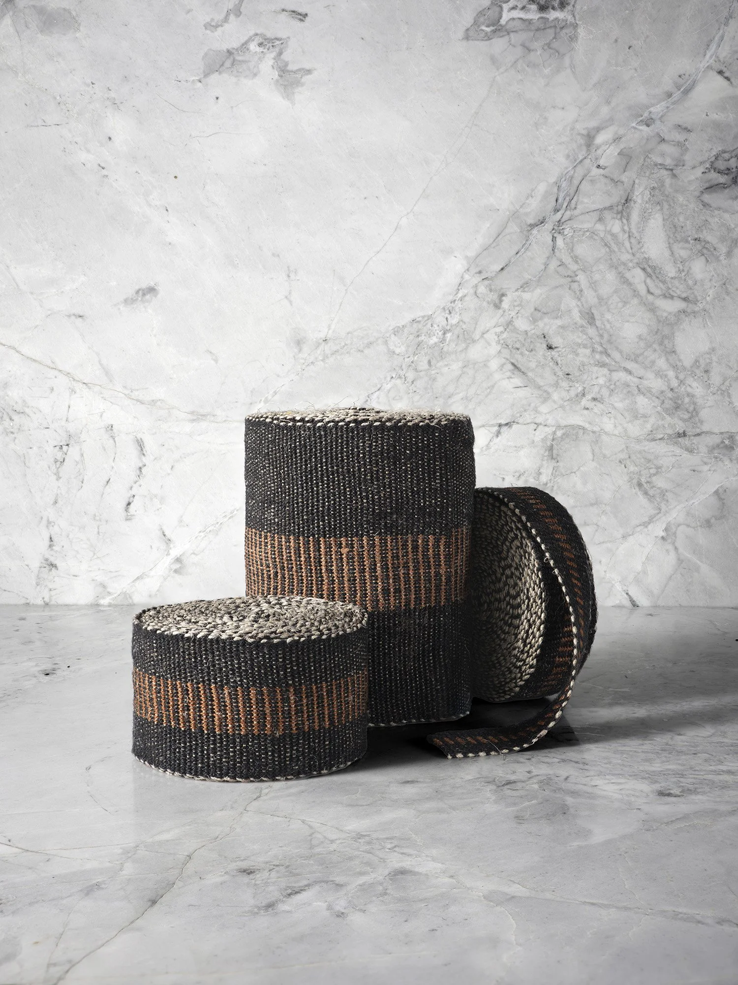 Cordwood handwoven linen tape trim with oak brown stacked bars on black in narrow, medium and wide widths.