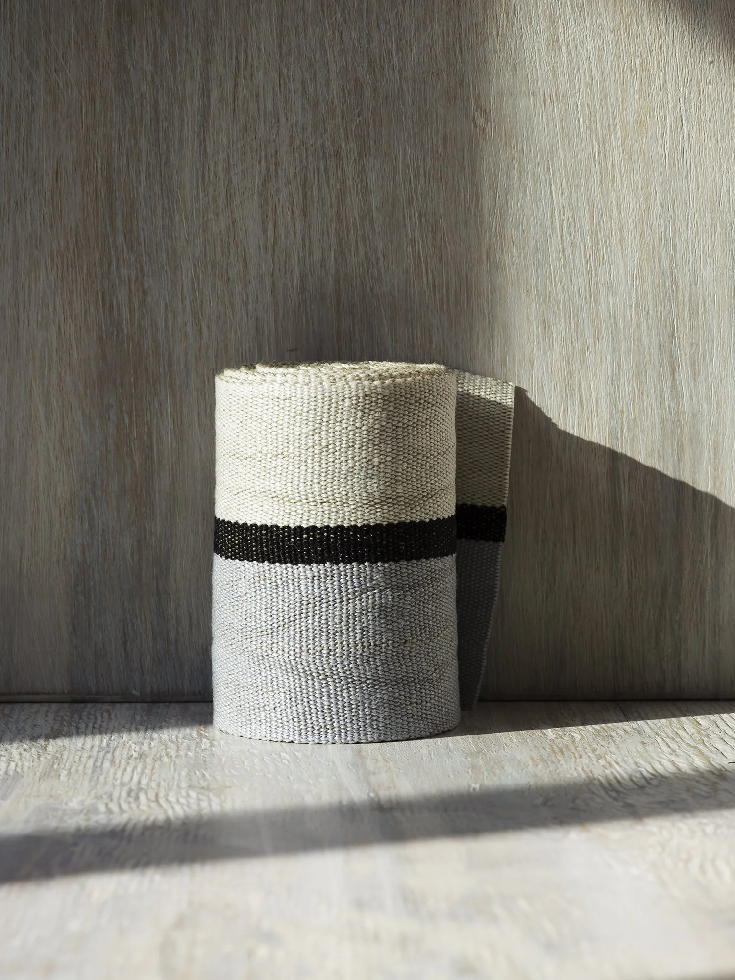 Ile Saint-Louis handwoven linen tape trim in silvery blue, black and white in wide width.