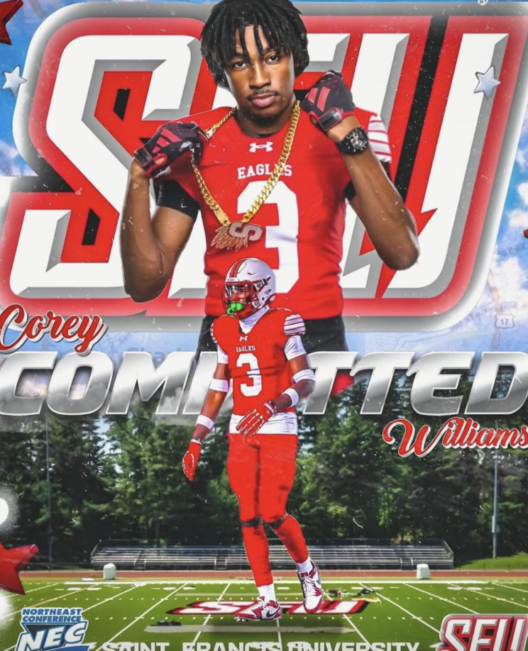 Athlete in red football uniform with the number 3, standing on a football field, wearing gloves and a watch, with a helmet held in one hand, posing confidently in front of a stadium background.