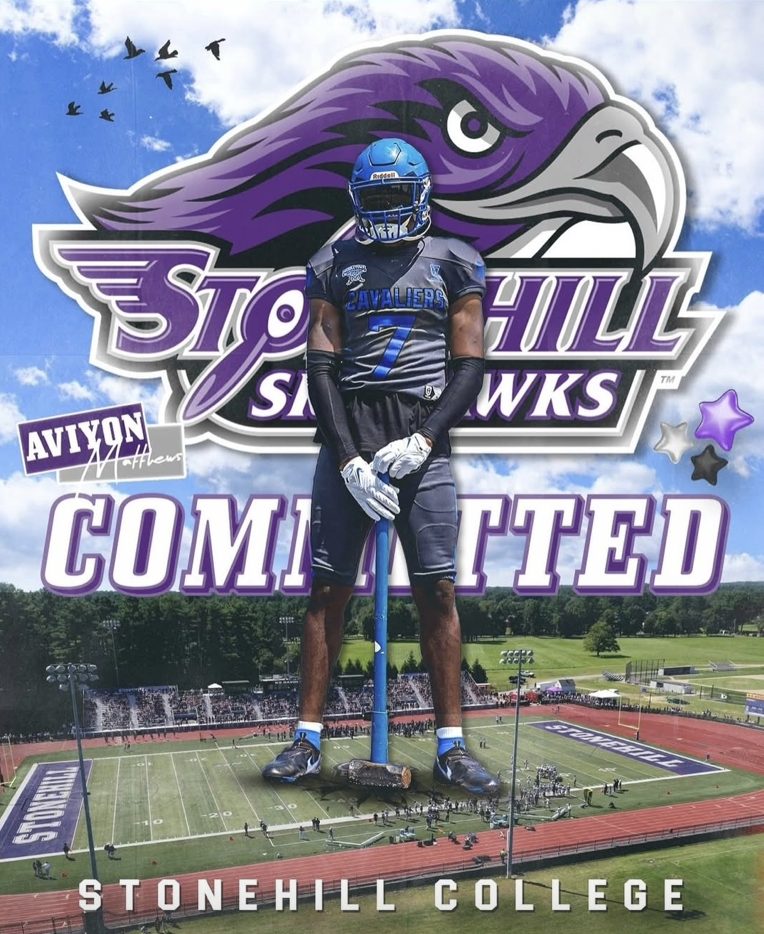 A football player in uniform standing with a giant stone hill with a hawk's head logo, college stadium, and text that reads 'Stonehill' and 'COMPETED' in the background, indicating a Stonehill College sports event.