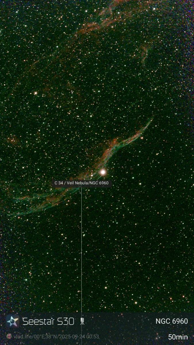 Image of the Veil Nebula (C 34 / NGC 6960), a supernova remnant in the constellation Cygnus, showing a bright star and faint, colorful gaseous filaments.