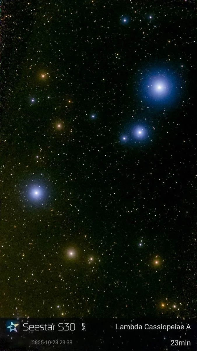 A photograph of a star-filled night sky featuring various bright stars and clusters, with labels indicating the Seestar S30 telescope and Lambda Cassiopeiae A.