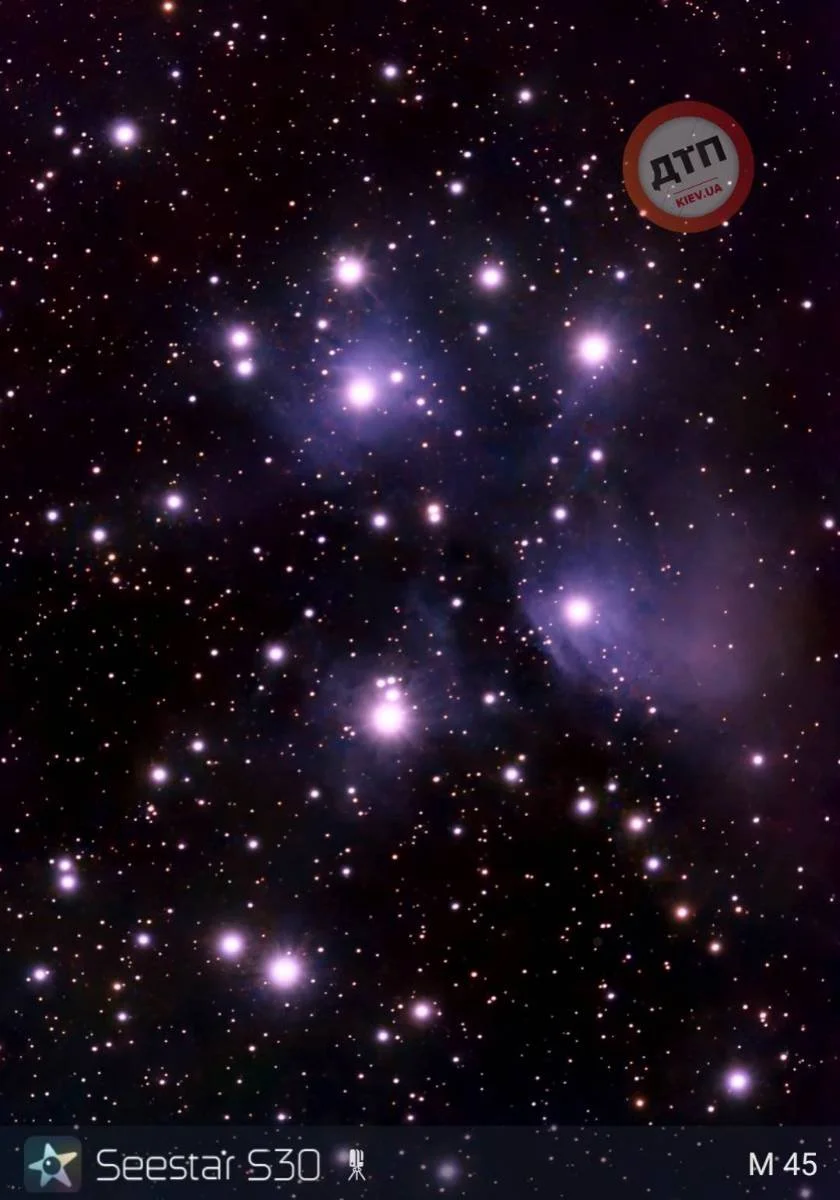 Image of a star cluster in space with numerous bright stars and nebulae, labeled with Seestar S30 and M45.