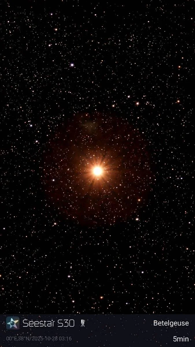 A bright star or celestial object in the center surrounded by countless smaller stars in black space.