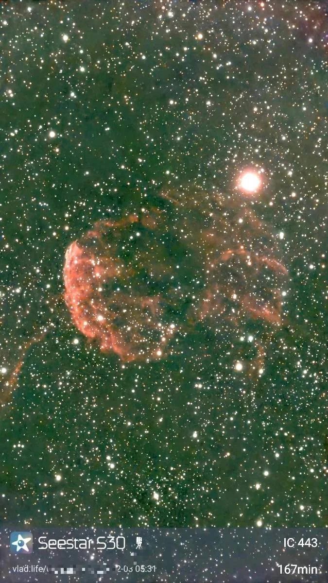 A colorful image of outer space featuring a nebula with a bright star, countless stars, and cosmic dust.