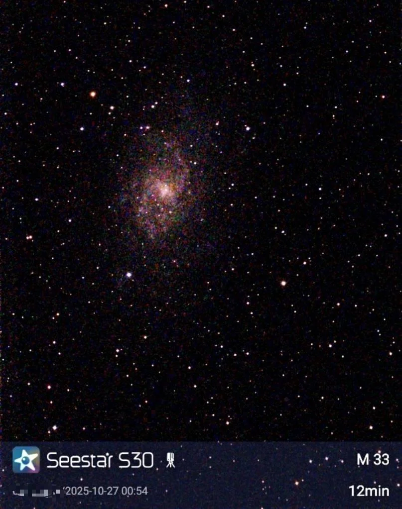A starry night sky with the center of the Milky Way galaxy visible, captured through a telescope. The image includes overlay text indicating the telescope model Seestar S30, the object M33, the date and time the photo was taken, and a 12-minute expos