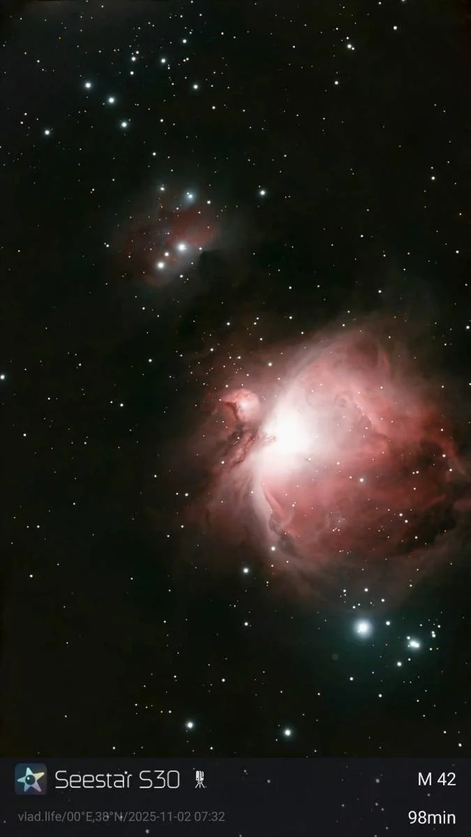 A detailed photograph of the Orion Nebula (M42) with many stars visible in the background, captured using a Seestar S30 telescope, showing the nebula's bright core and surrounding reddish gas clouds.
