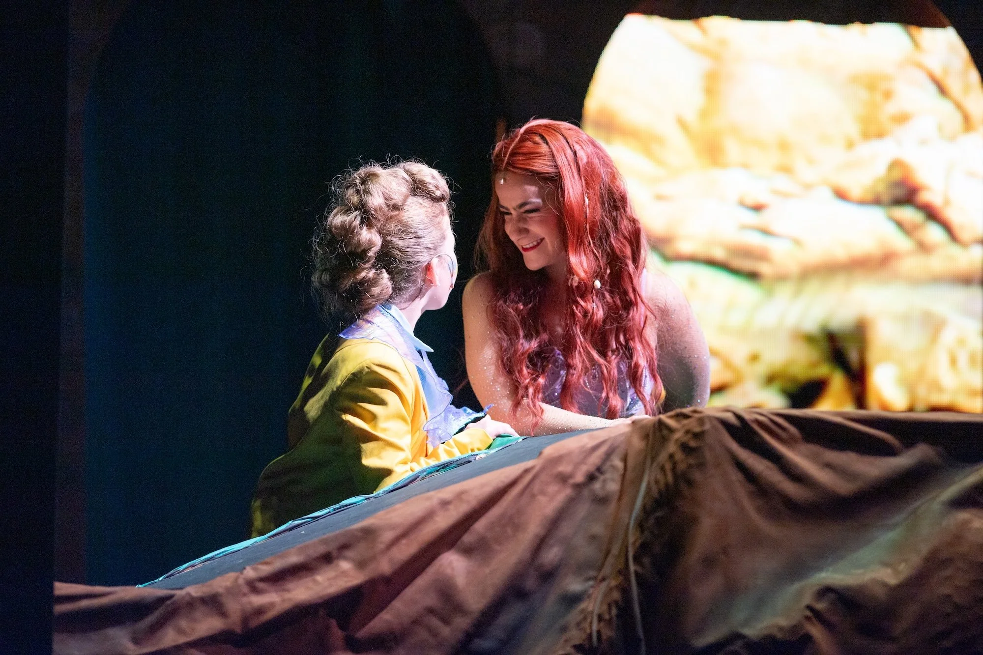 Cat Rojo as Ariel laughing with Flounder