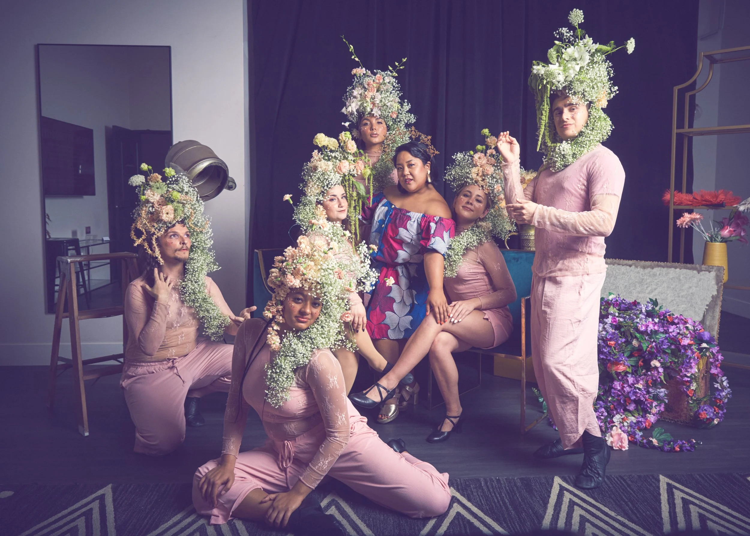 Cat Rojo along with five other performers and their creative director, Jesca Prudencio, posed together in a studio shot at the Solstice Soirée for The Old Globe in San Diego
