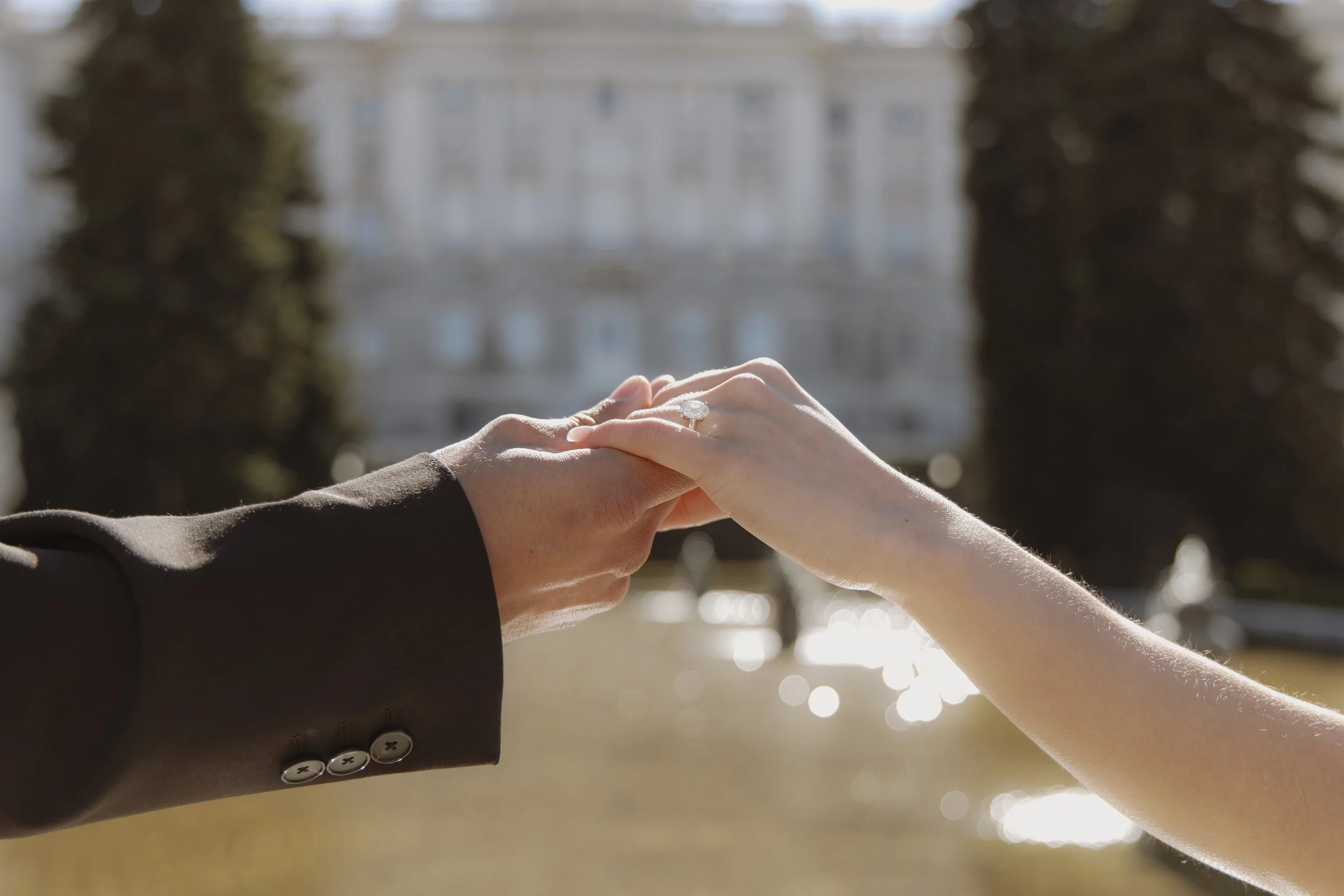 Candid surprise proposal photography in sabatini gardens with the golden hour and the engagement ring