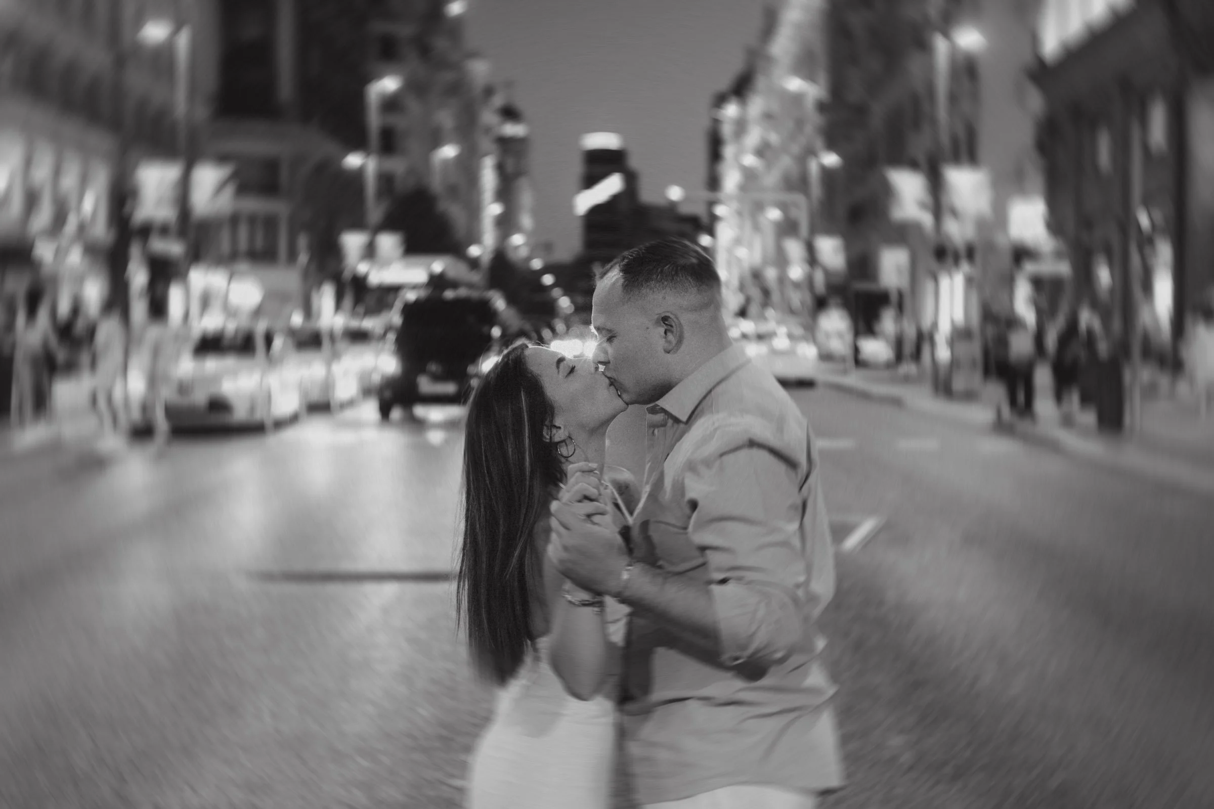 Engagement photos in Gran Via street in Madrid with elegant and film style