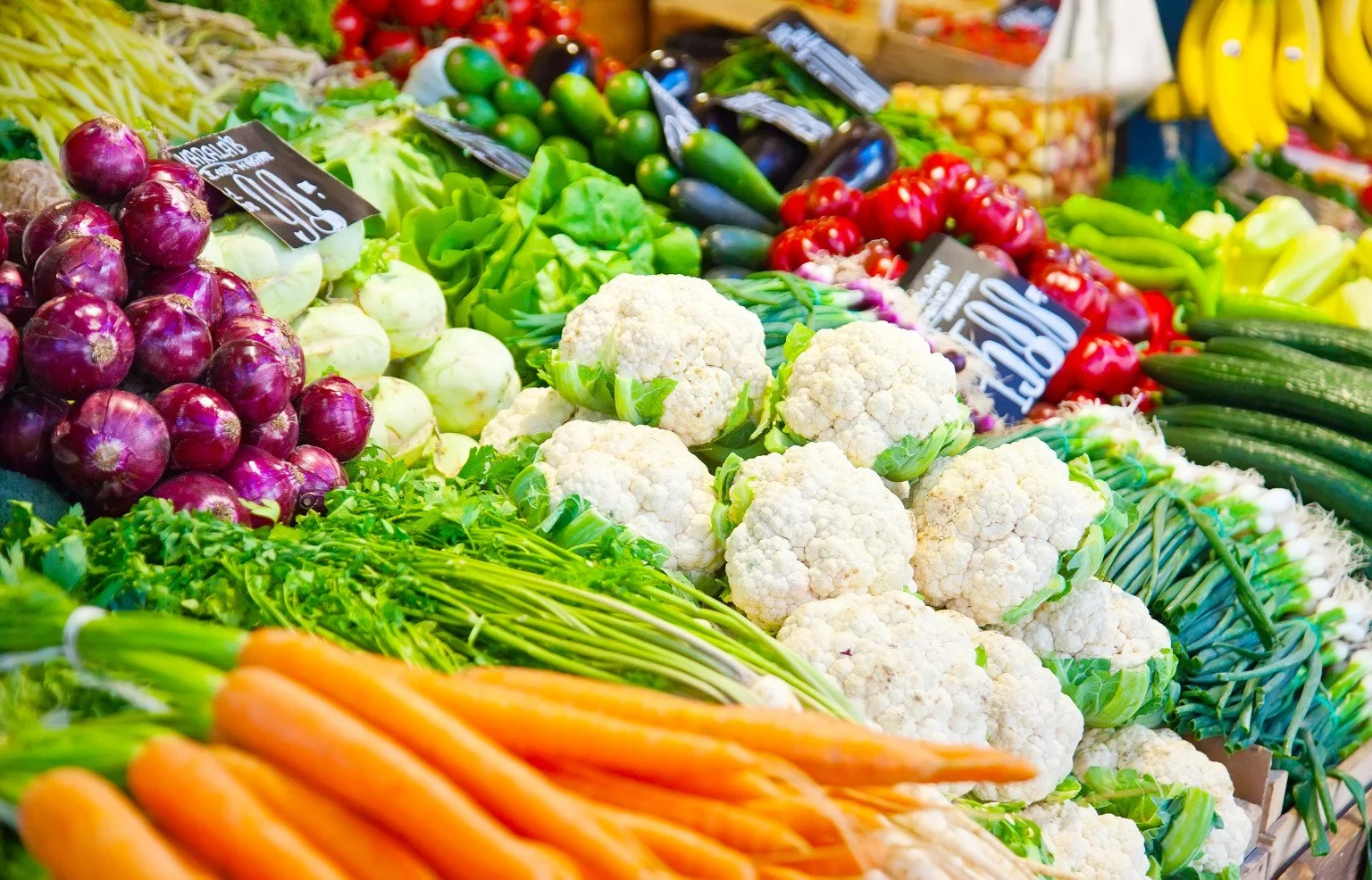 Market stall displaying fresh vegetables and produce