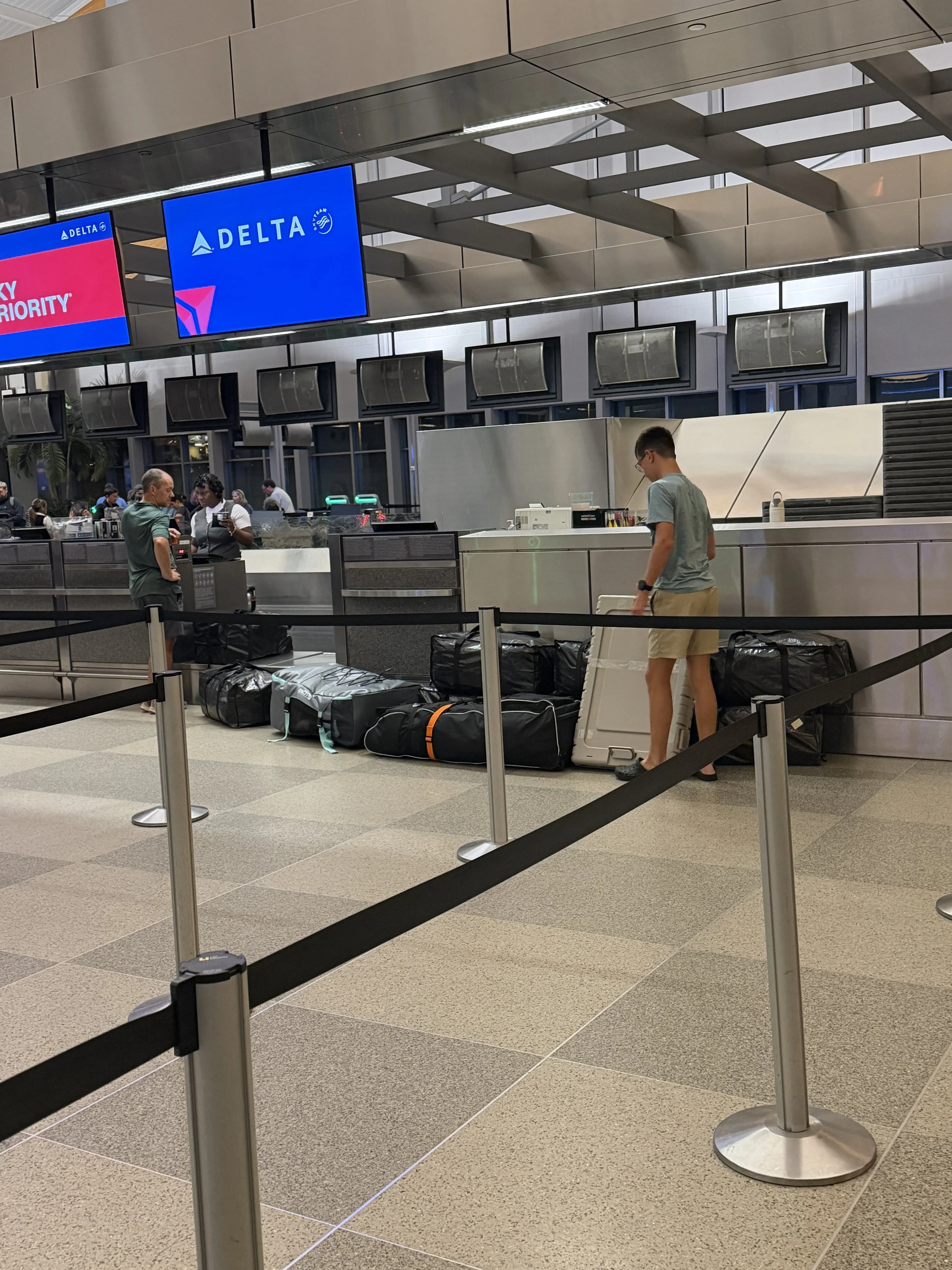 At RDU with our belongings for a year in 12 checked bags, 4 carry-ons and 4 personal items
